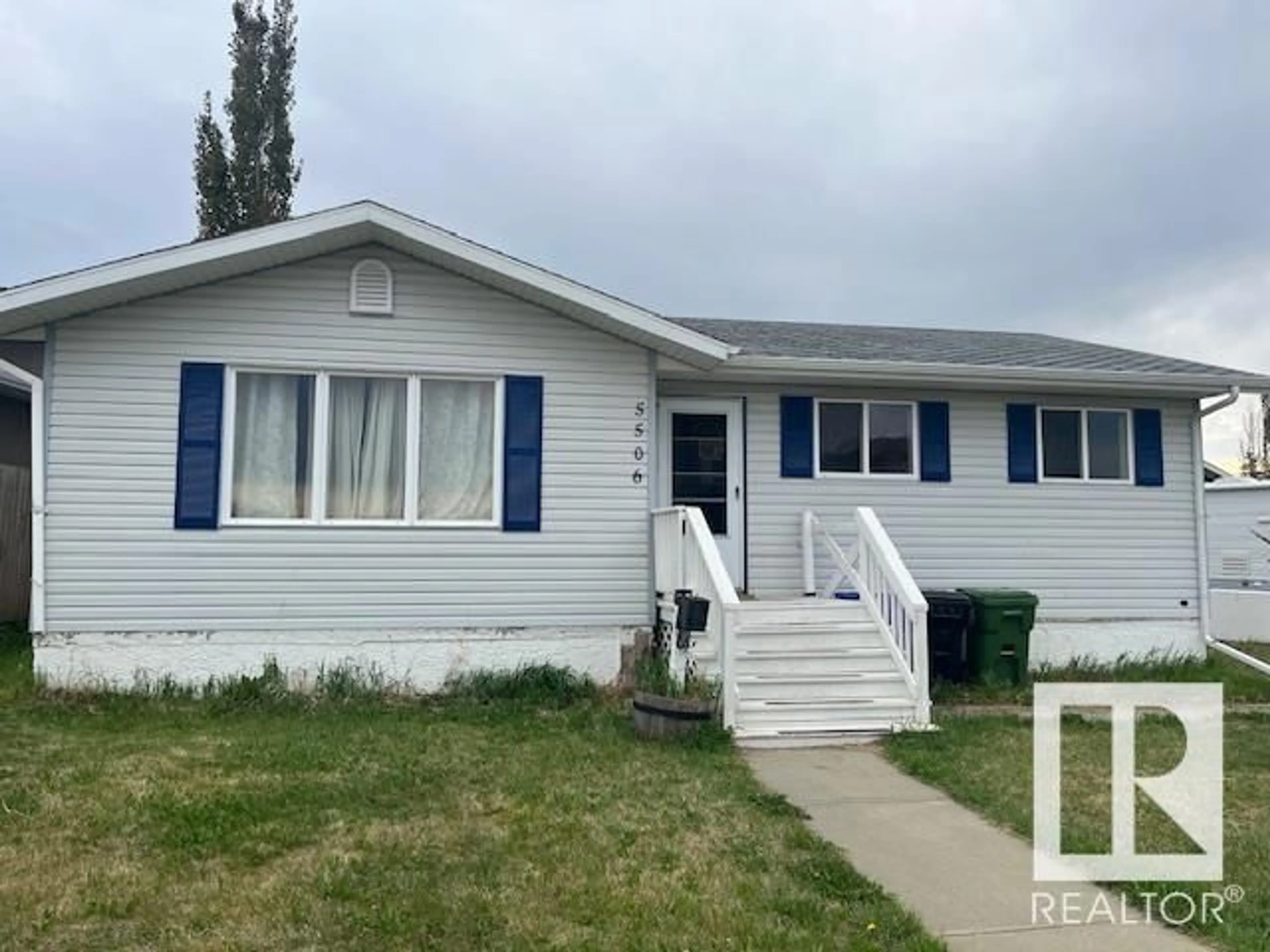 Home with vinyl exterior material, street for 5506 45 ST, Bruderheim Alberta T0B0S0
