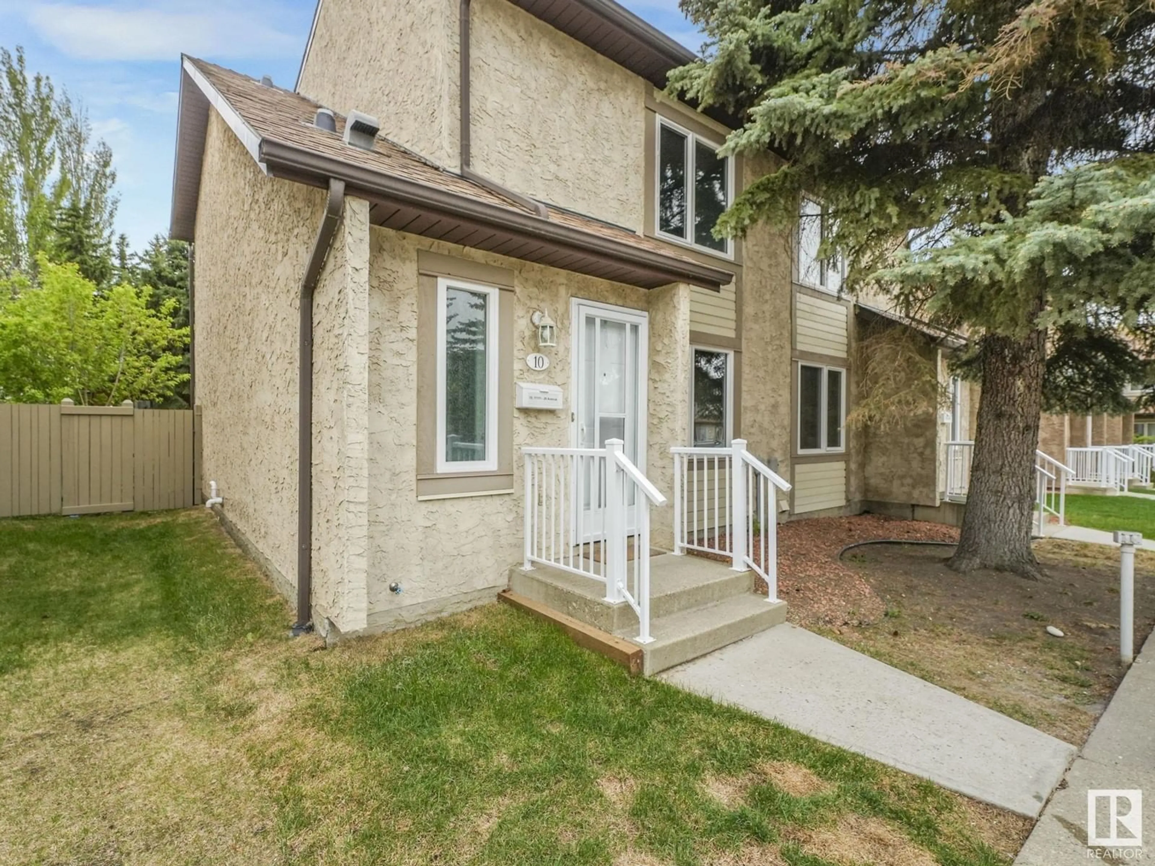 Home with vinyl exterior material, street for 10 11111 26 AV, Edmonton Alberta T6J5M7