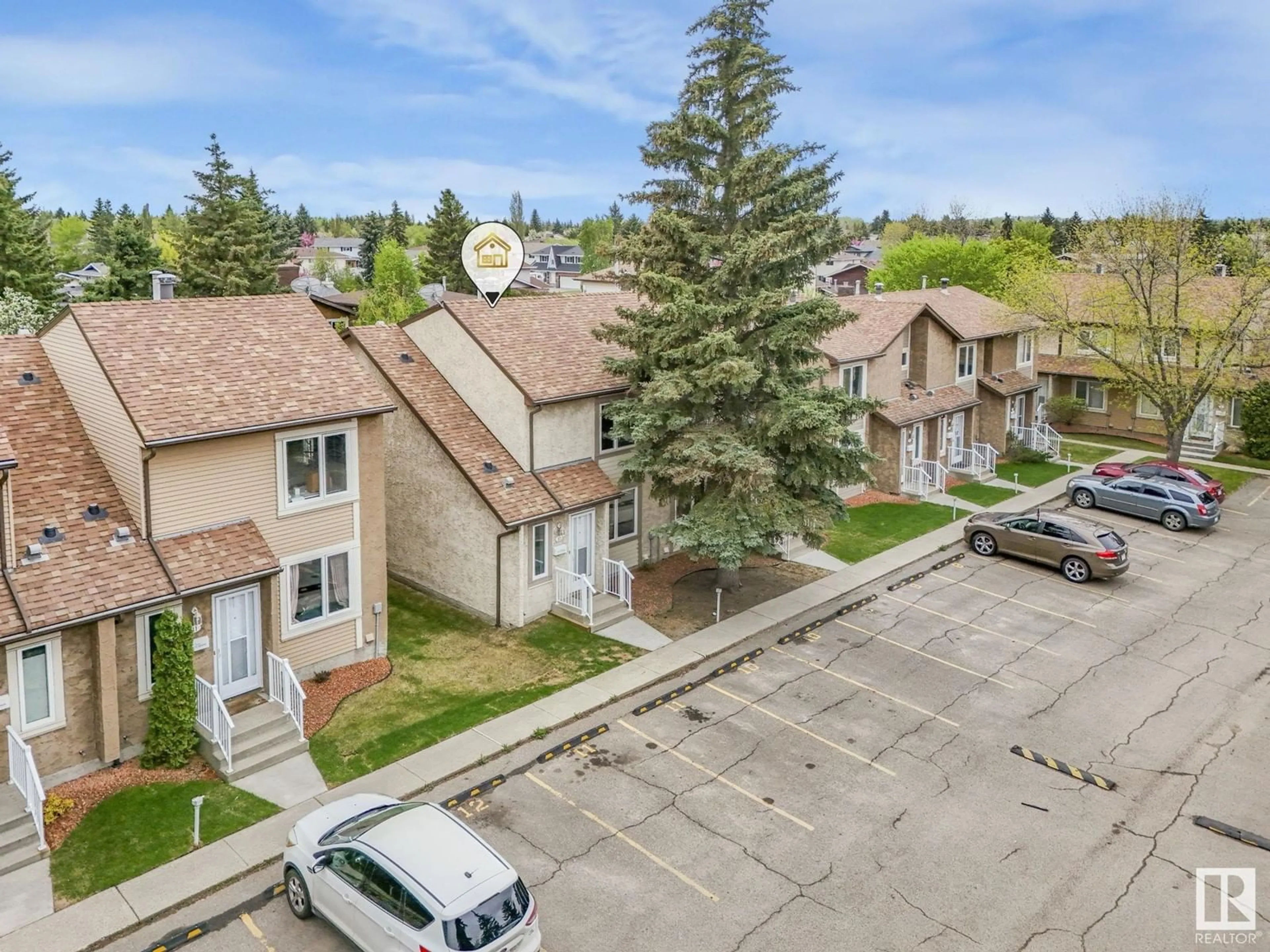 A pic from outside/outdoor area/front of a property/back of a property/a pic from drone, unknown for 10 11111 26 AV, Edmonton Alberta T6J5M7