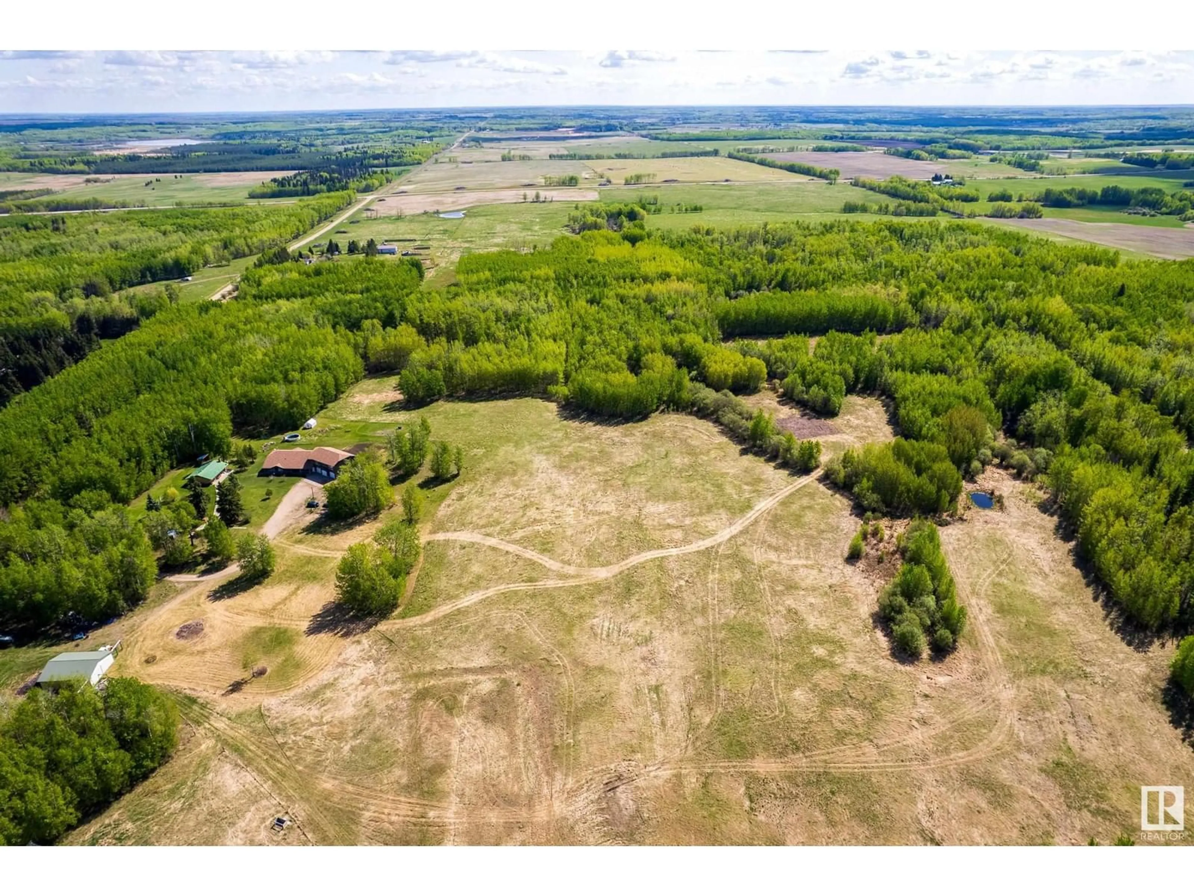 A pic from outside/outdoor area/front of a property/back of a property/a pic from drone, unknown for 6521 TWP RD 554, Rural Lac Ste. Anne County Alberta T0E2A0