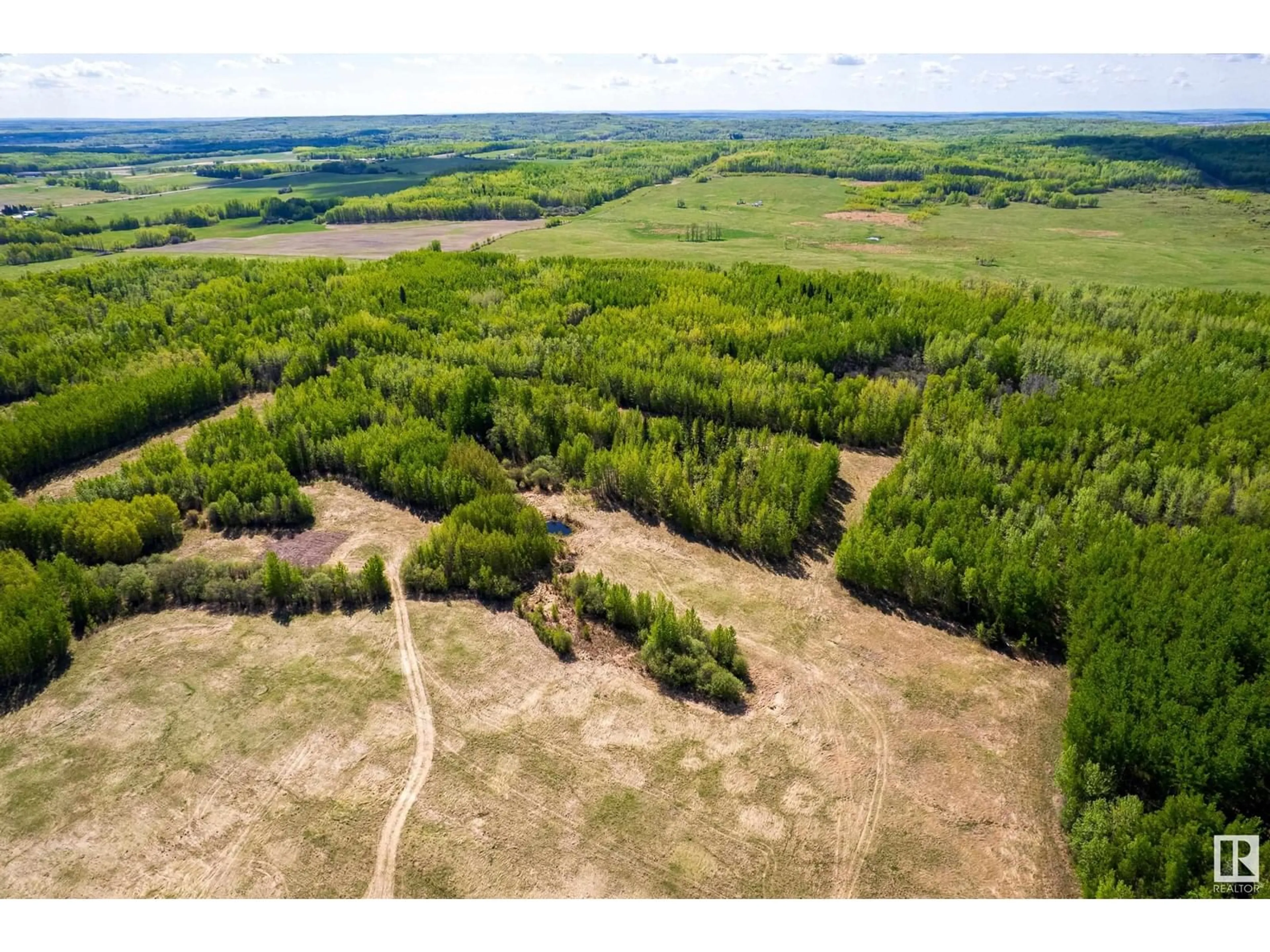 A pic from outside/outdoor area/front of a property/back of a property/a pic from drone, forest/trees view for 6521 TWP RD 554, Rural Lac Ste. Anne County Alberta T0E2A0