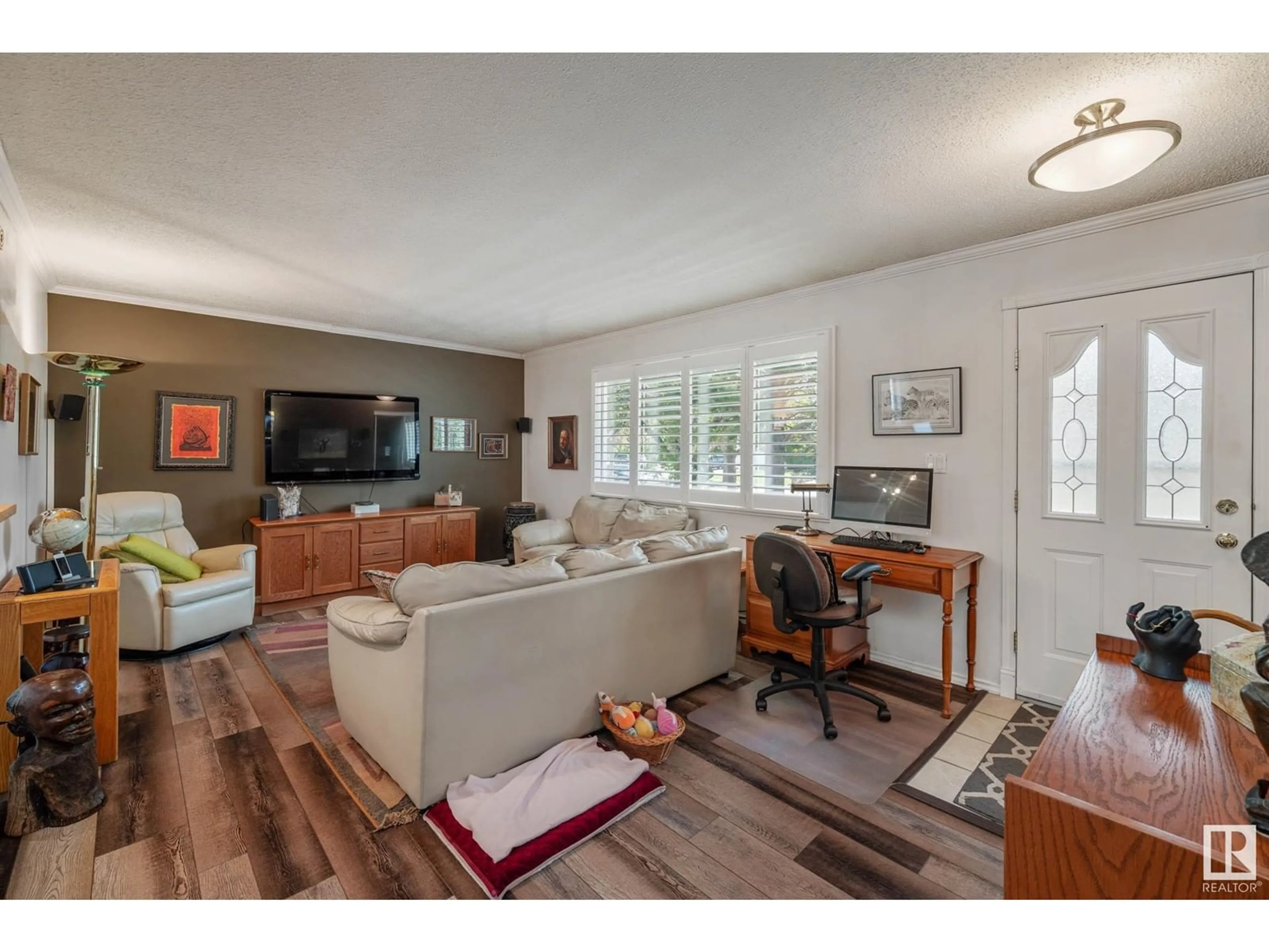 Living room with furniture, wood/laminate floor for 28 FOREST DR, St. Albert Alberta T8N1X2