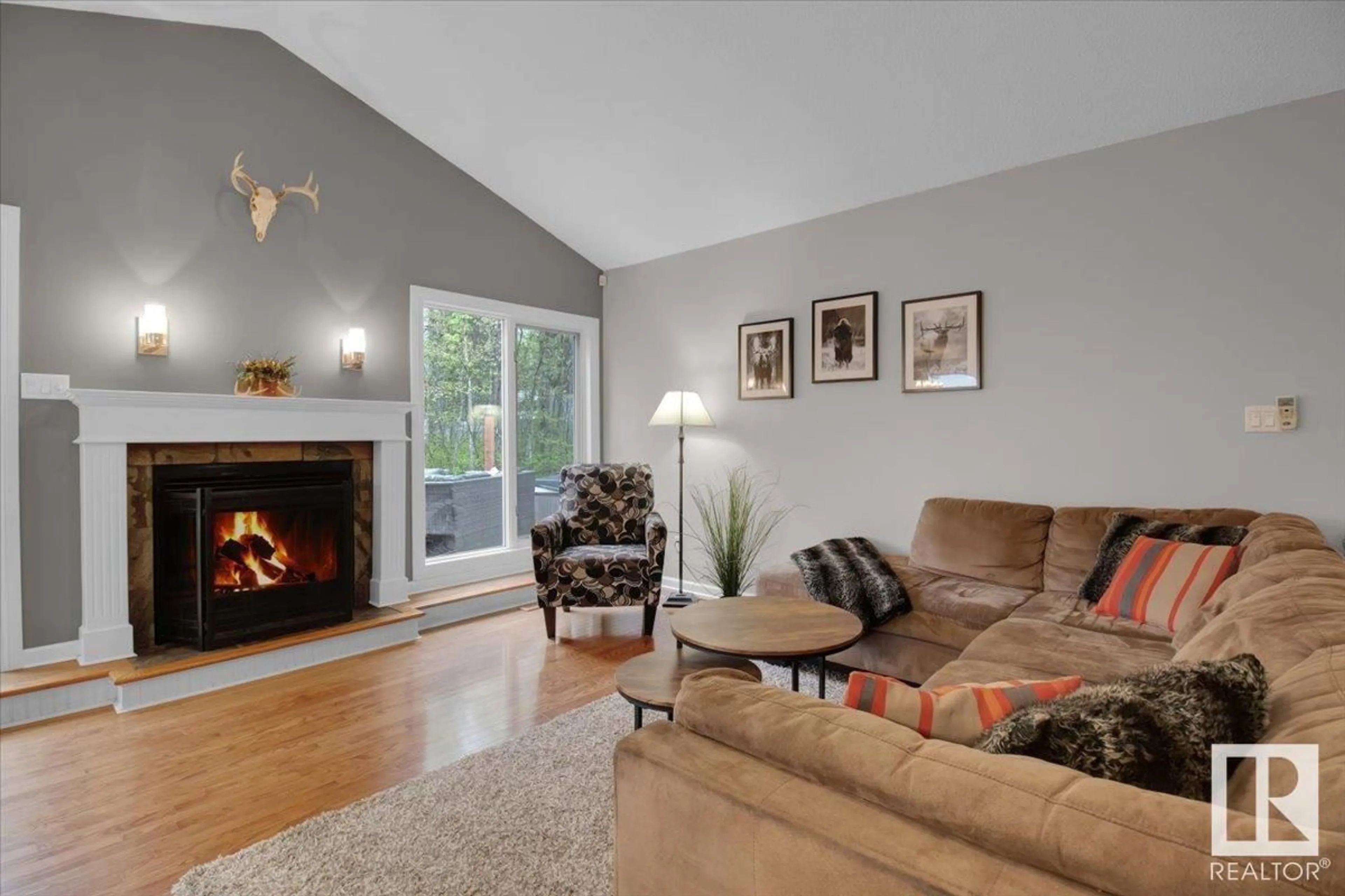 Living room with furniture, wood/laminate floor for 53407 RGE ROAD 30, Rural Parkland County Alberta T7Y0E4