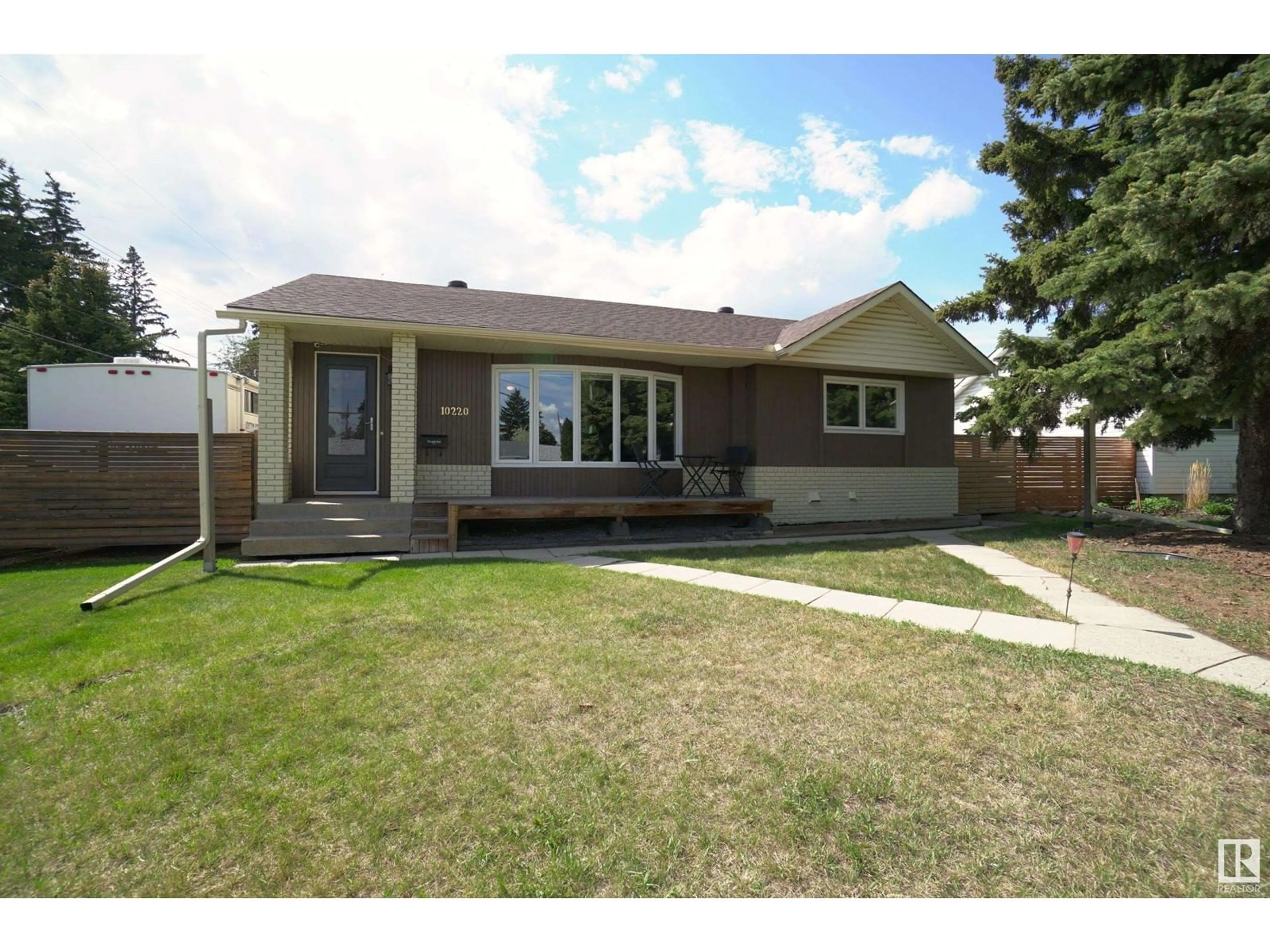 Home with vinyl exterior material, street for NW - 10220 62 ST, Edmonton Alberta T6A2L8