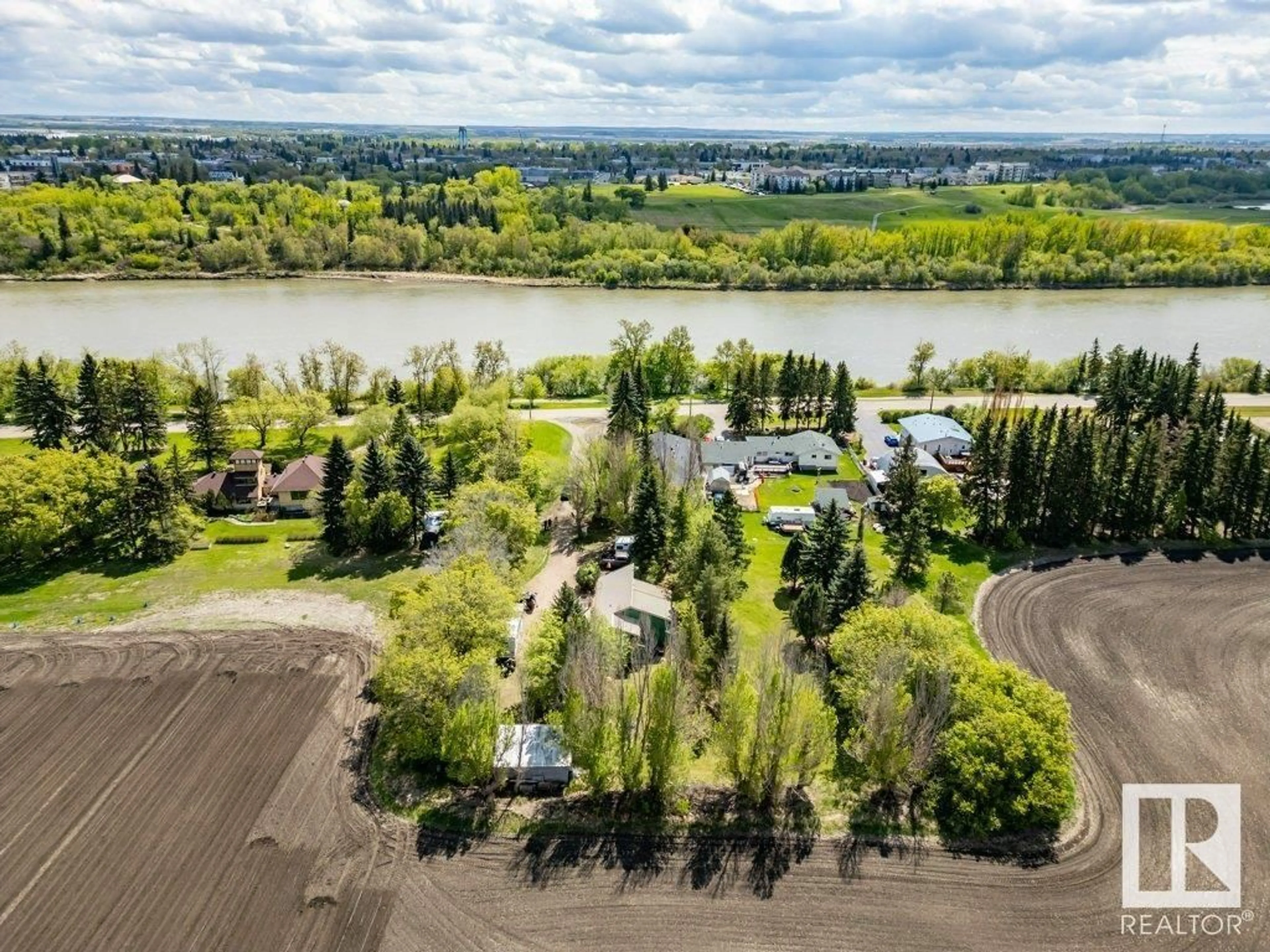 A pic from outside/outdoor area/front of a property/back of a property/a pic from drone, water/lake/river/ocean view for 55000 - 38 LAMOUREUX DR, Rural Sturgeon County Alberta T8L5A7