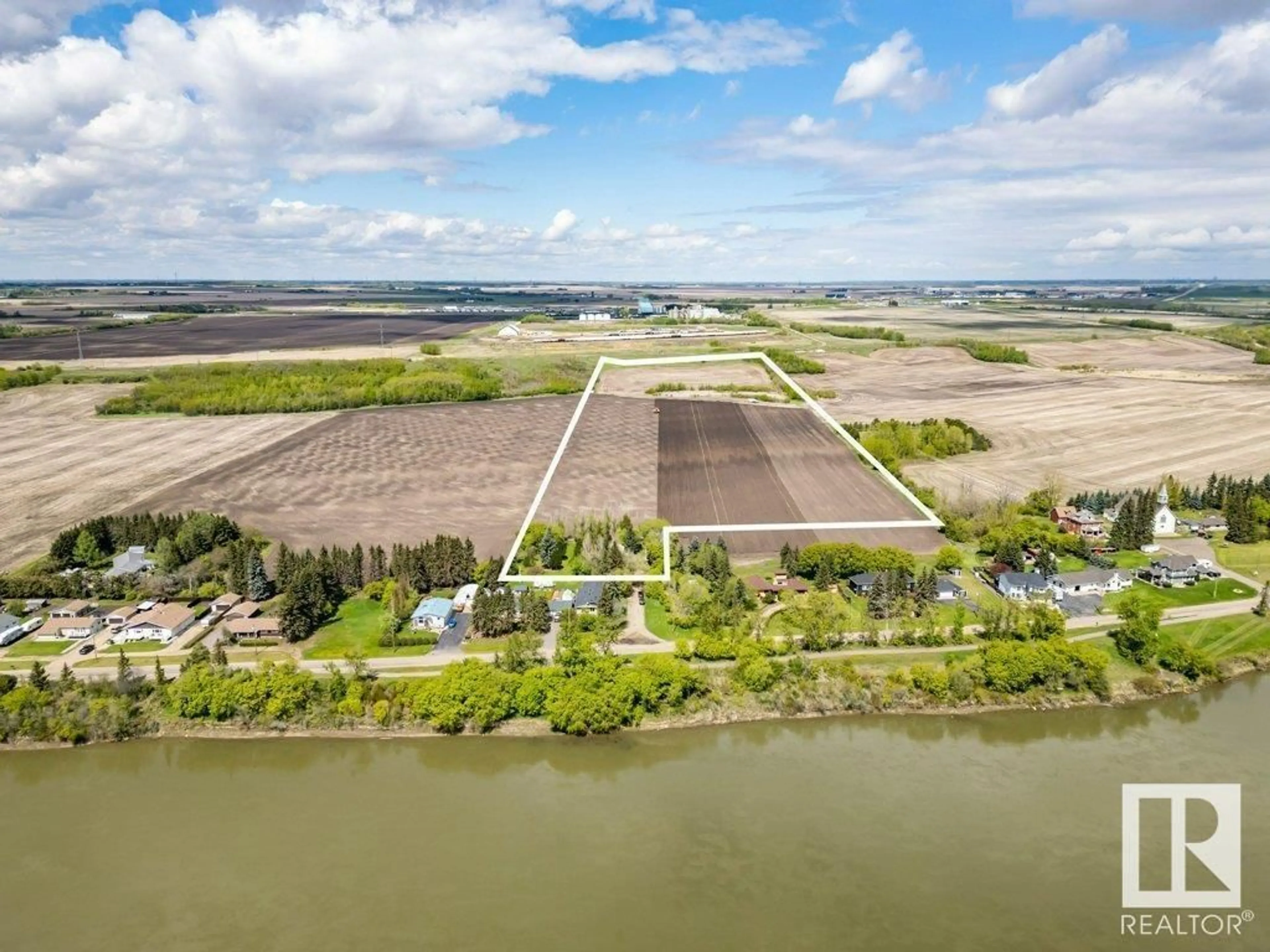 A pic from outside/outdoor area/front of a property/back of a property/a pic from drone, water/lake/river/ocean view for 55000 - 38 LAMOUREUX DR, Rural Sturgeon County Alberta T8L5A7