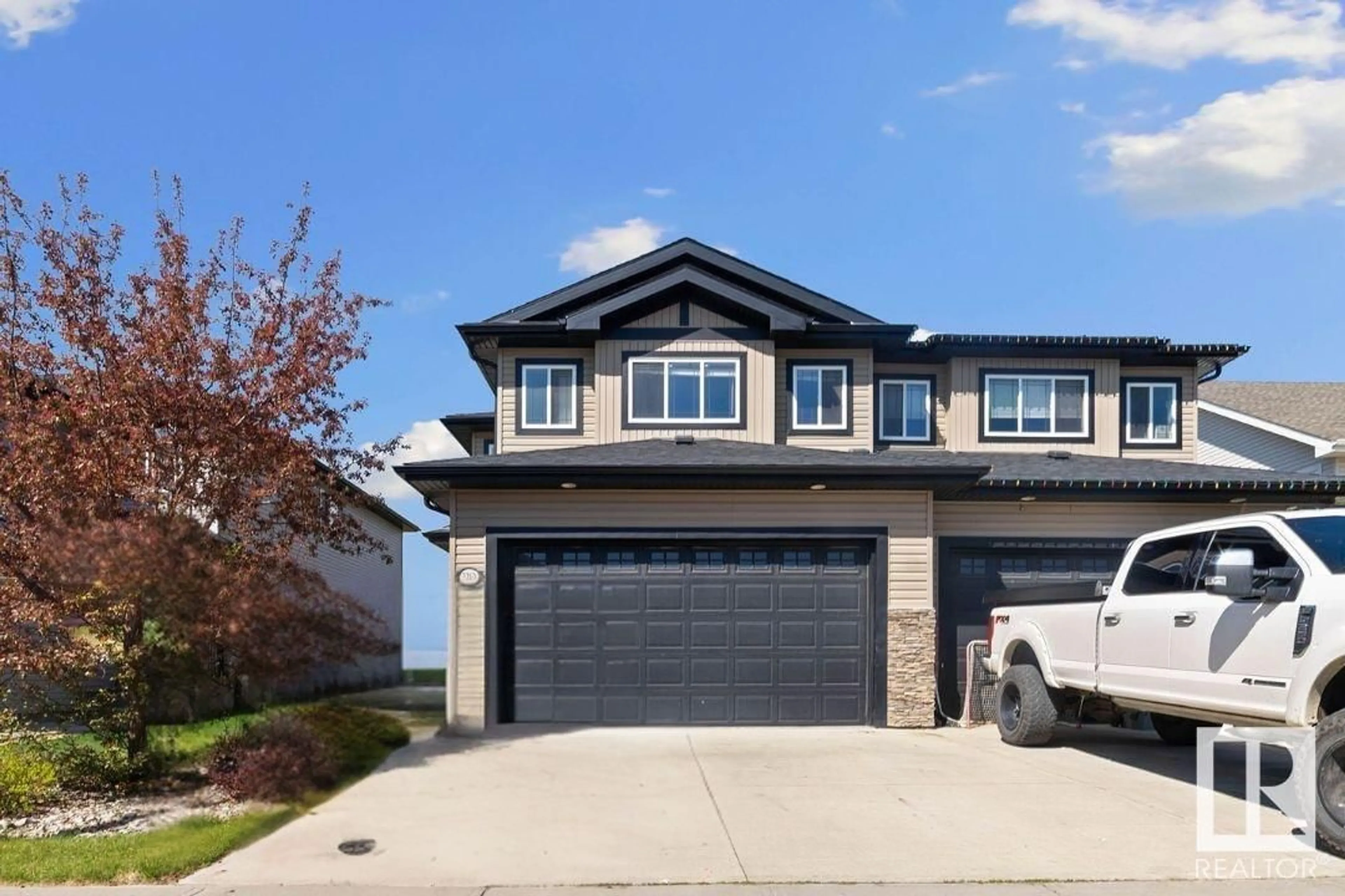 Home with vinyl exterior material, street for 3210 67 ST, Beaumont Alberta T4X0W7