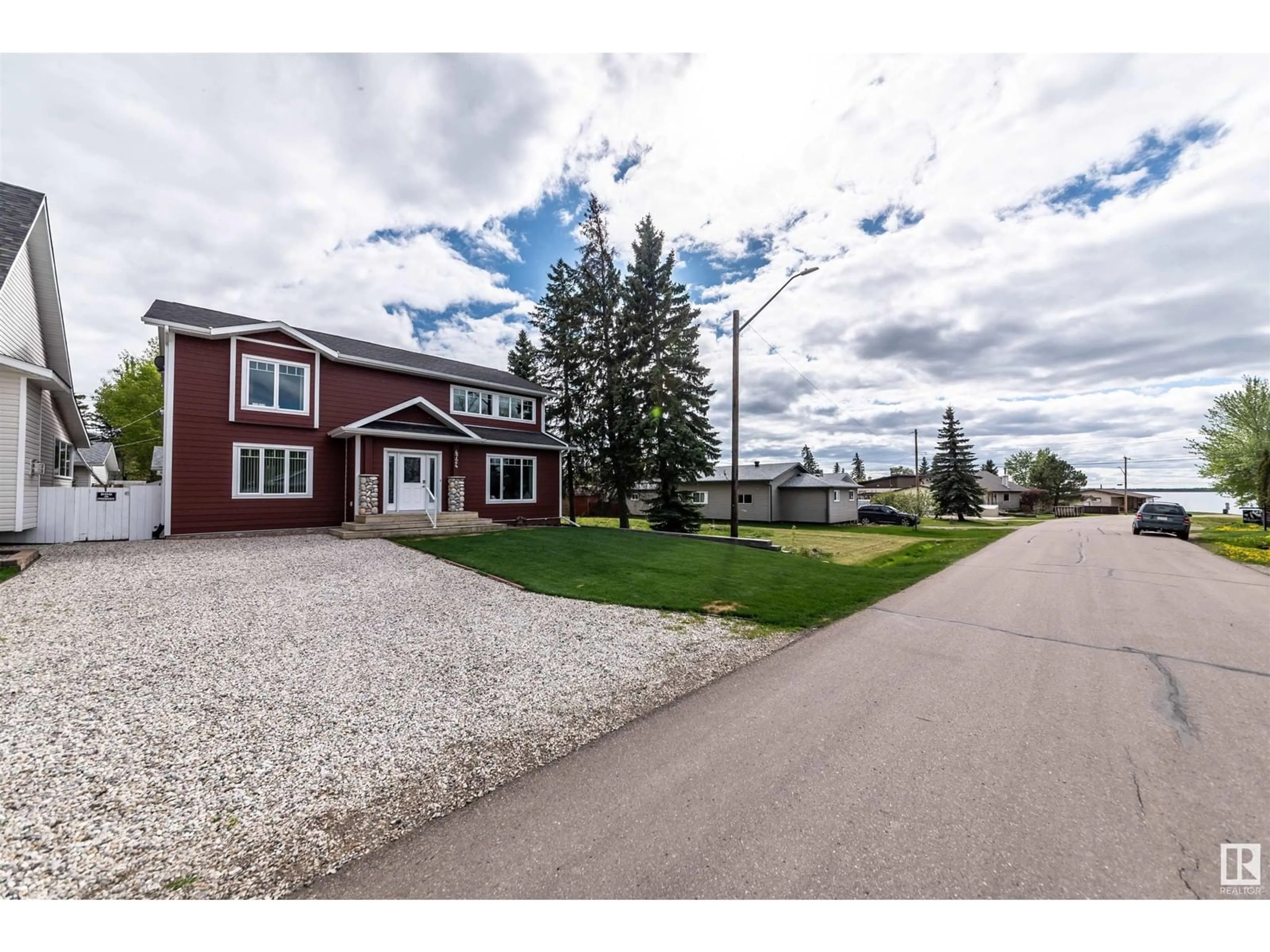 A pic from outside/outdoor area/front of a property/back of a property/a pic from drone, water/lake/river/ocean view for 4724 44 ST, Rural Lac Ste. Anne County Alberta T0E0A0