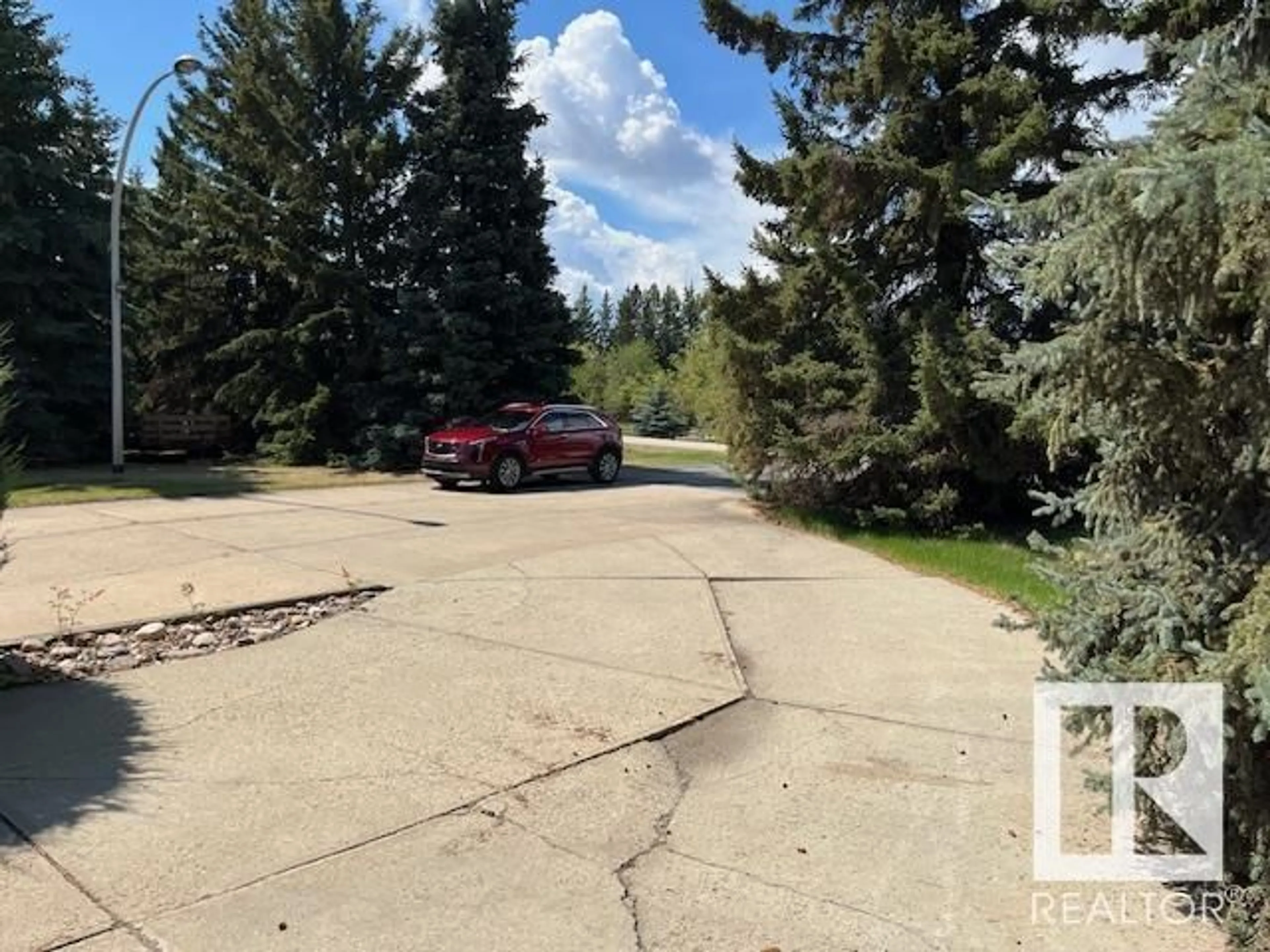 A pic from outside/outdoor area/front of a property/back of a property/a pic from drone, street for 32 24119 TWP ROAD 554, Rural Sturgeon County Alberta T8T1X7
