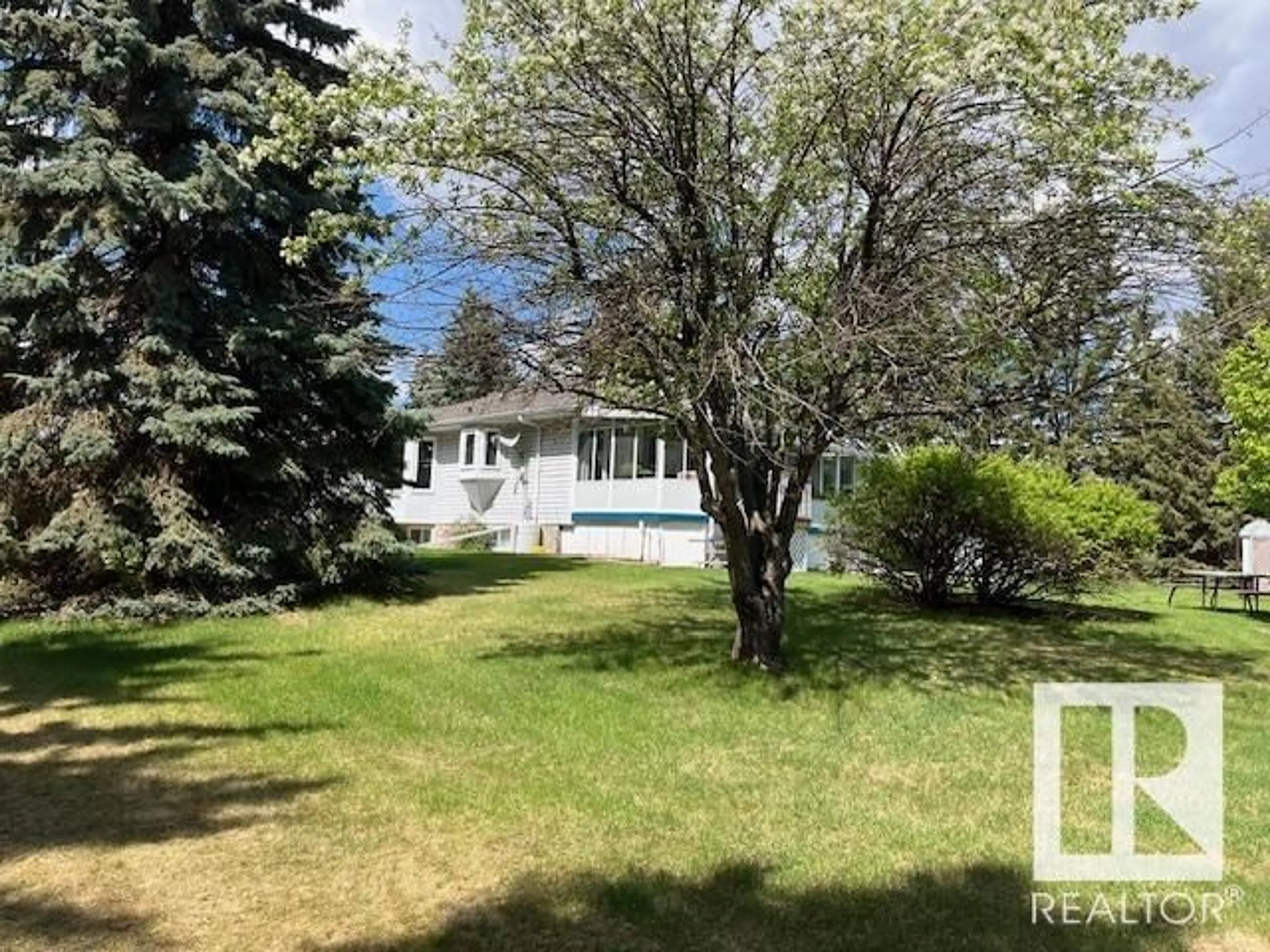 A pic from outside/outdoor area/front of a property/back of a property/a pic from drone, street for 32 24119 TWP ROAD 554, Rural Sturgeon County Alberta T8T1X7