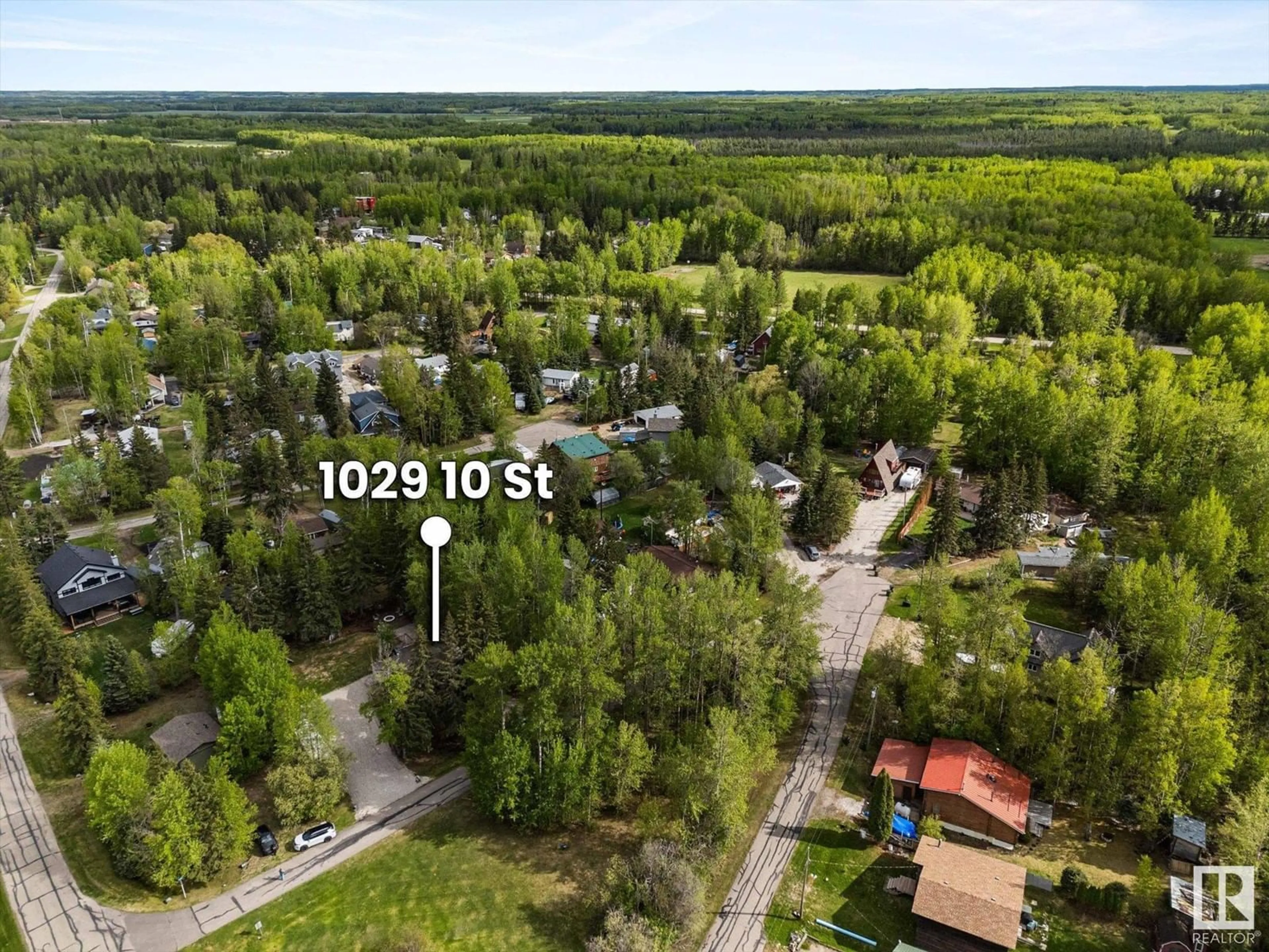 A pic from outside/outdoor area/front of a property/back of a property/a pic from drone, forest/trees view for 1028-1029 10 ST, Rural Lac Ste. Anne County Alberta T0E0A2