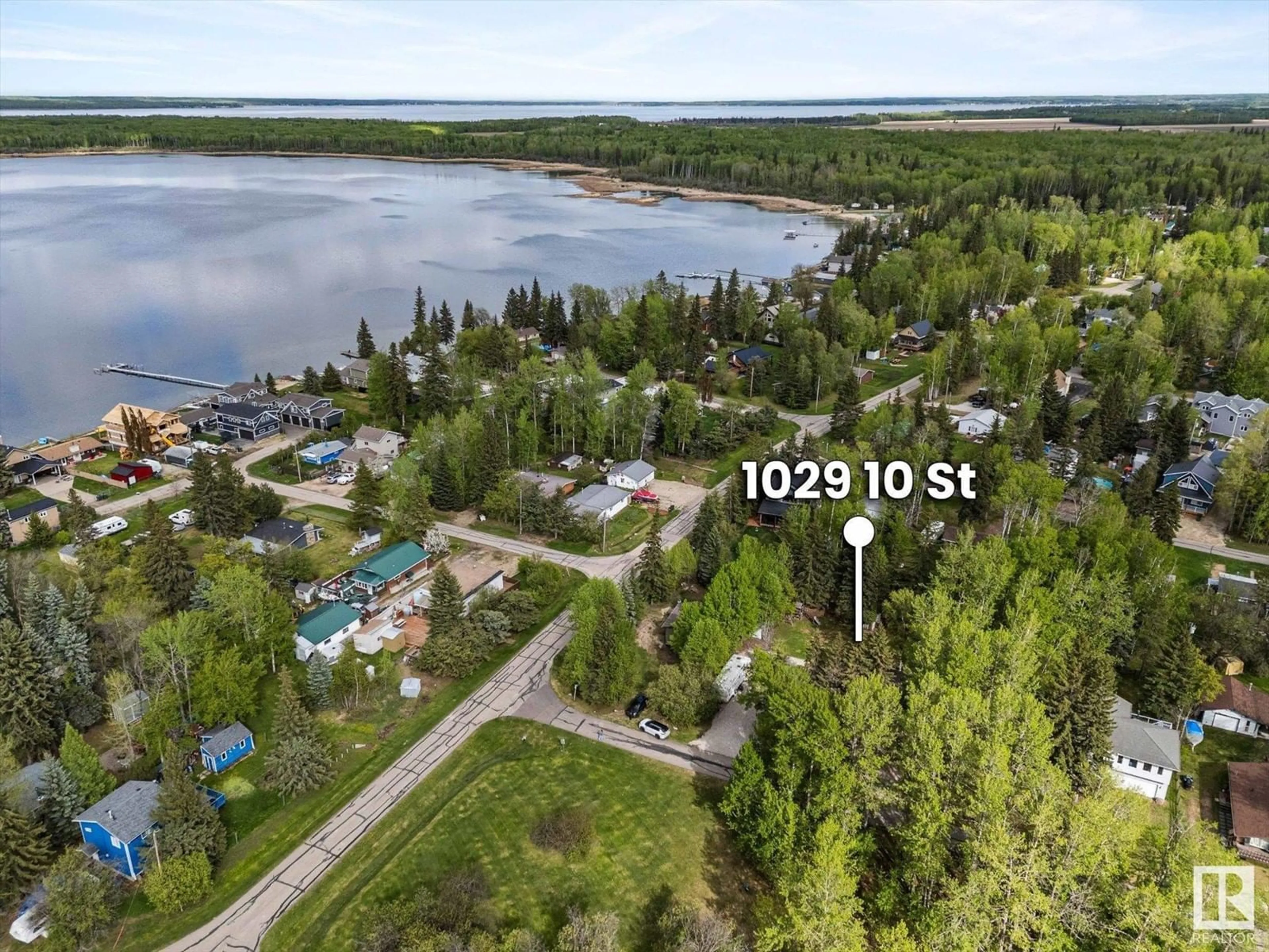 A pic from outside/outdoor area/front of a property/back of a property/a pic from drone, water/lake/river/ocean view for 1028-1029 10 ST, Rural Lac Ste. Anne County Alberta T0E0A2