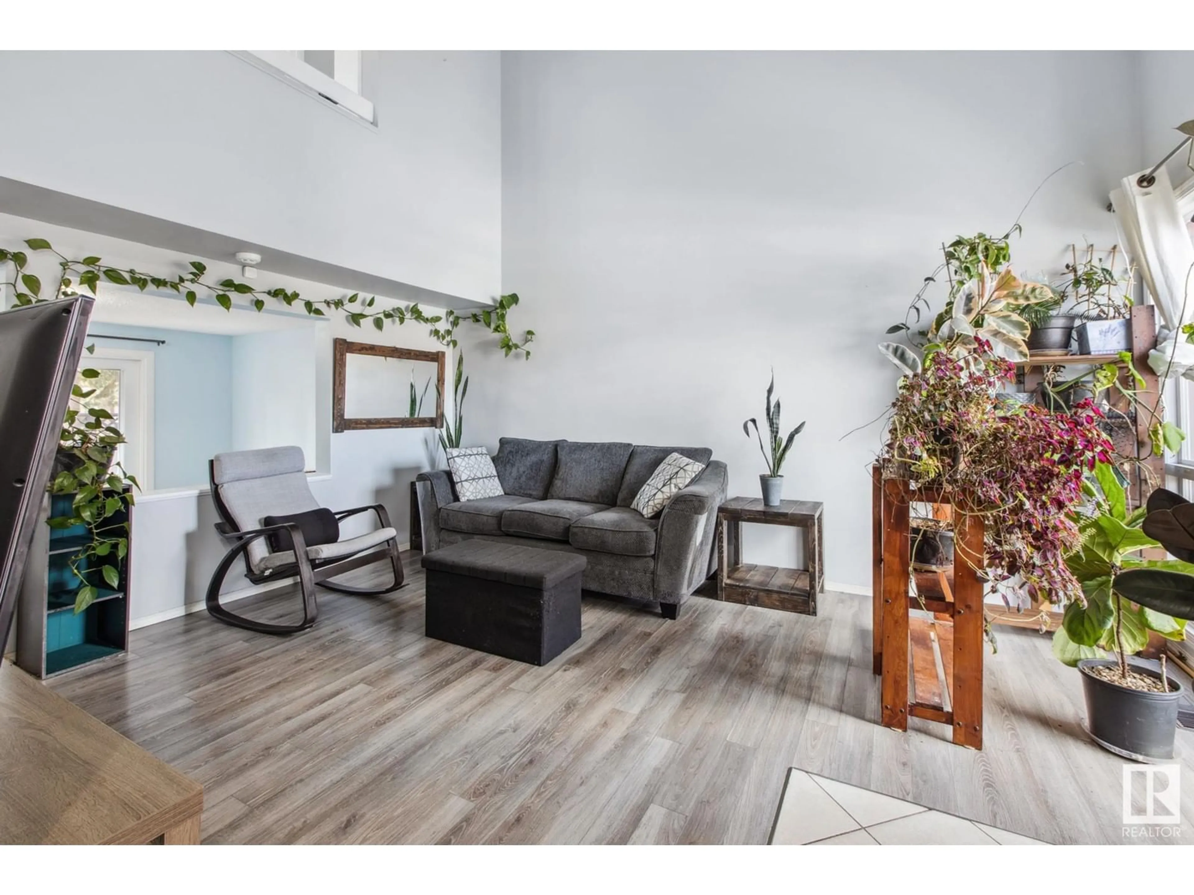 Living room with furniture, wood/laminate floor for 667 MILLBOURNE RD E RD, Edmonton Alberta T6K3H3