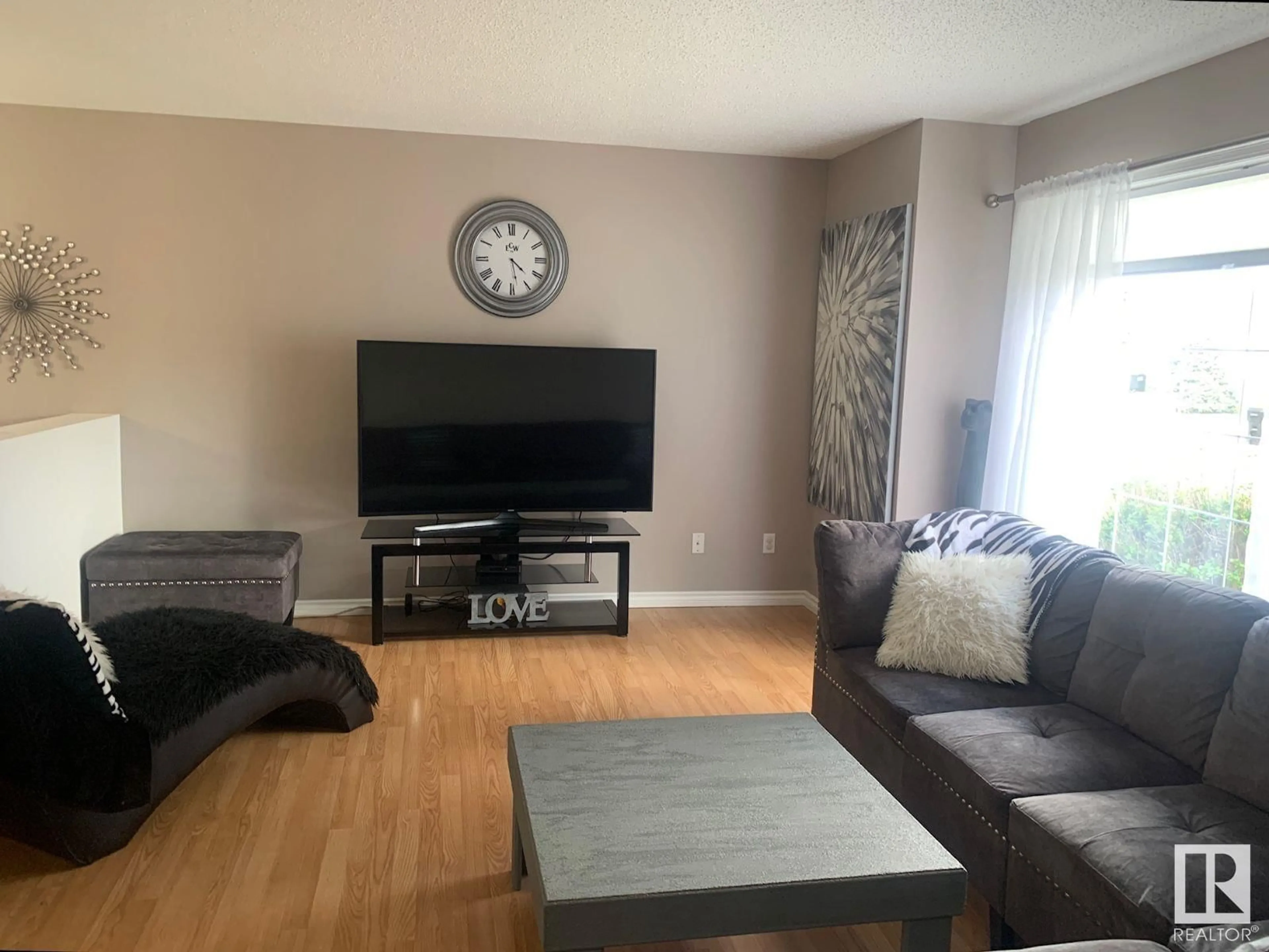 Living room with furniture, wood/laminate floor for NW - 15024 128 ST, Edmonton Alberta T6V1E9