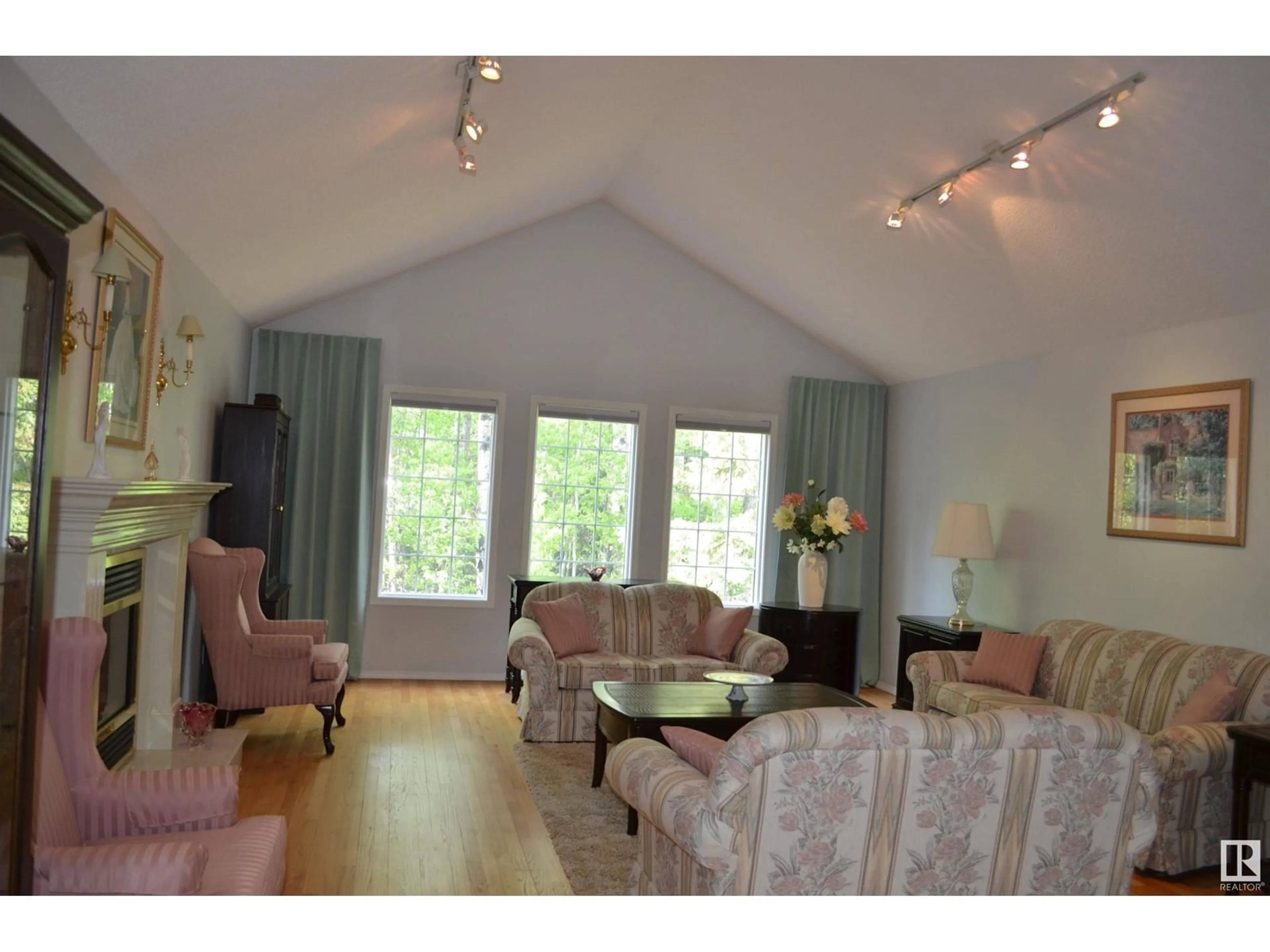 Living room with furniture, wood/laminate floor for 37 - 51128 RGE ROAD 261, Rural Parkland County Alberta T7Y1B8