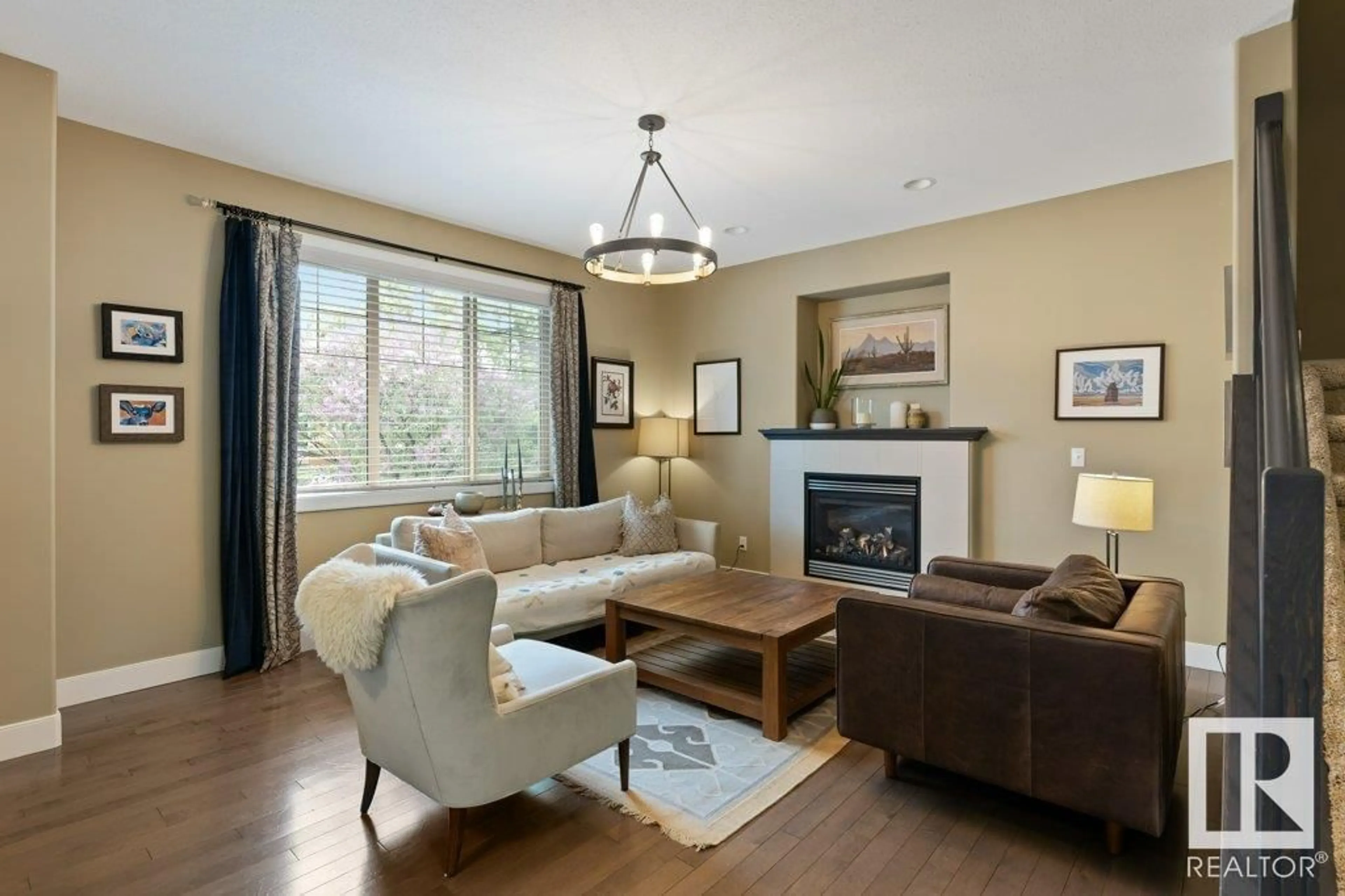 Living room with furniture, wood/laminate floor for 10506 71 AV, Edmonton Alberta T6E0X1