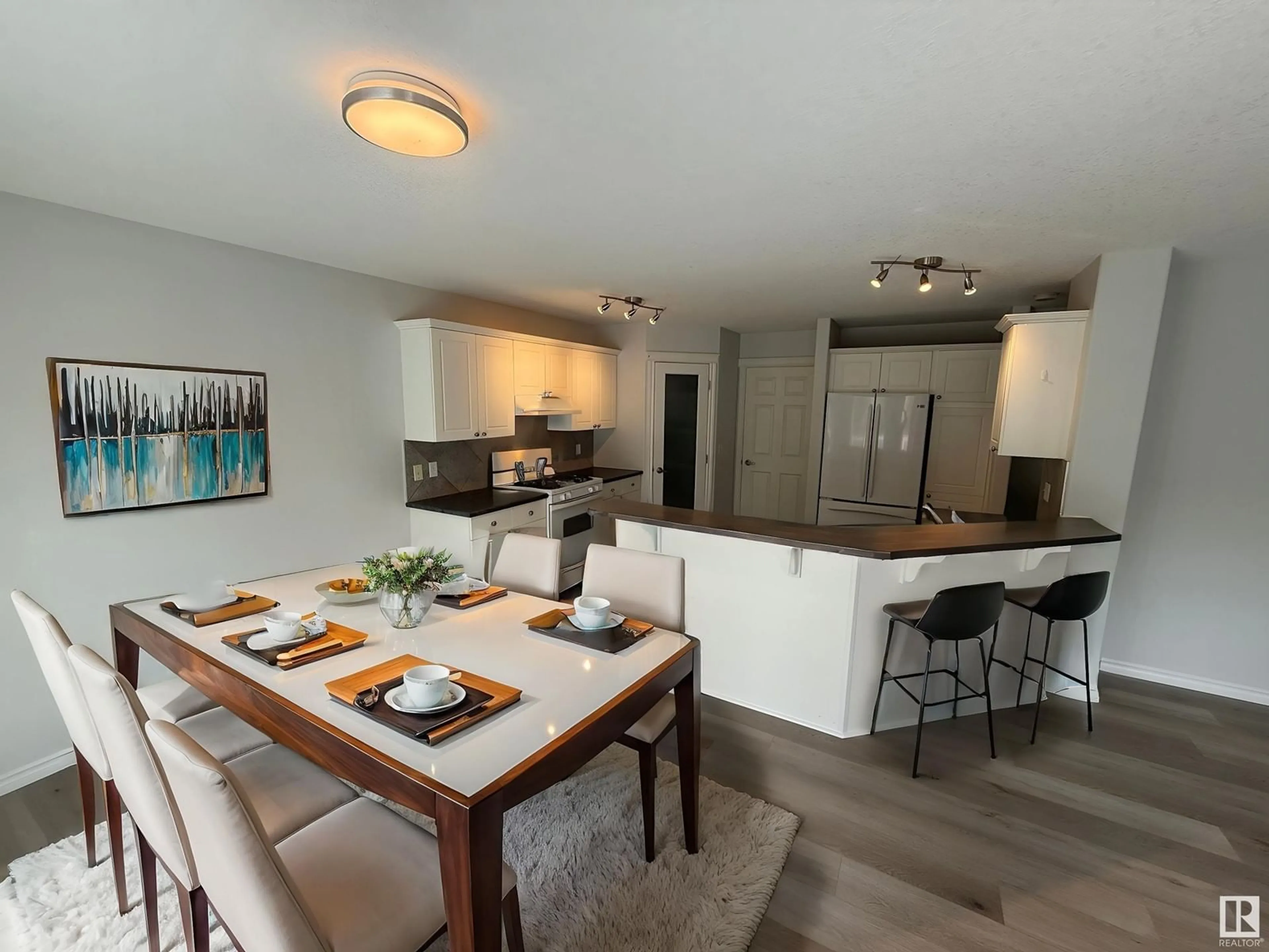 Open concept kitchen, wood/laminate floor for 530 KLARVATTEN LAKE WD, Edmonton Alberta T5Z3M1