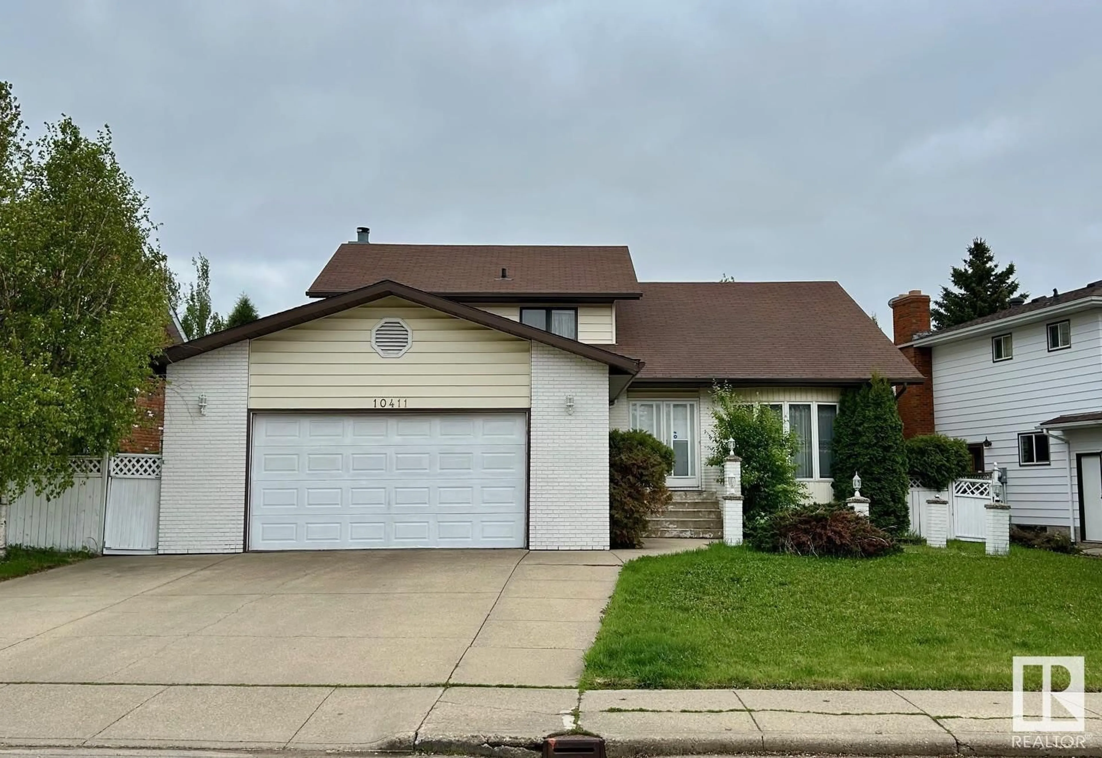 Home with vinyl exterior material, street for NW - 10411 21 AV, Edmonton Alberta T6J5E9