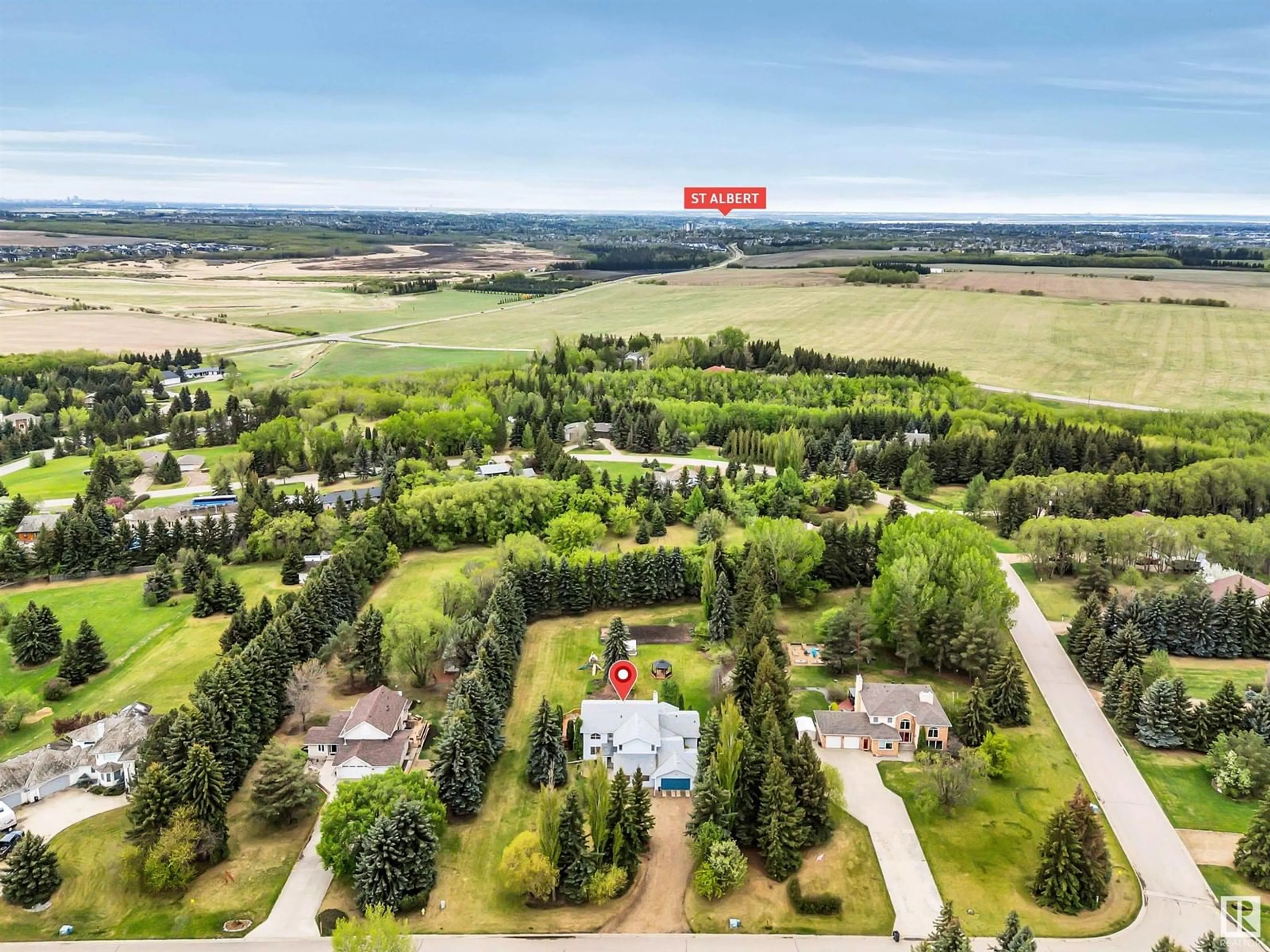 A pic from outside/outdoor area/front of a property/back of a property/a pic from drone, mountain view for #44 - 54324 BELLEROSE DR, Rural Sturgeon County Alberta T8N1M9