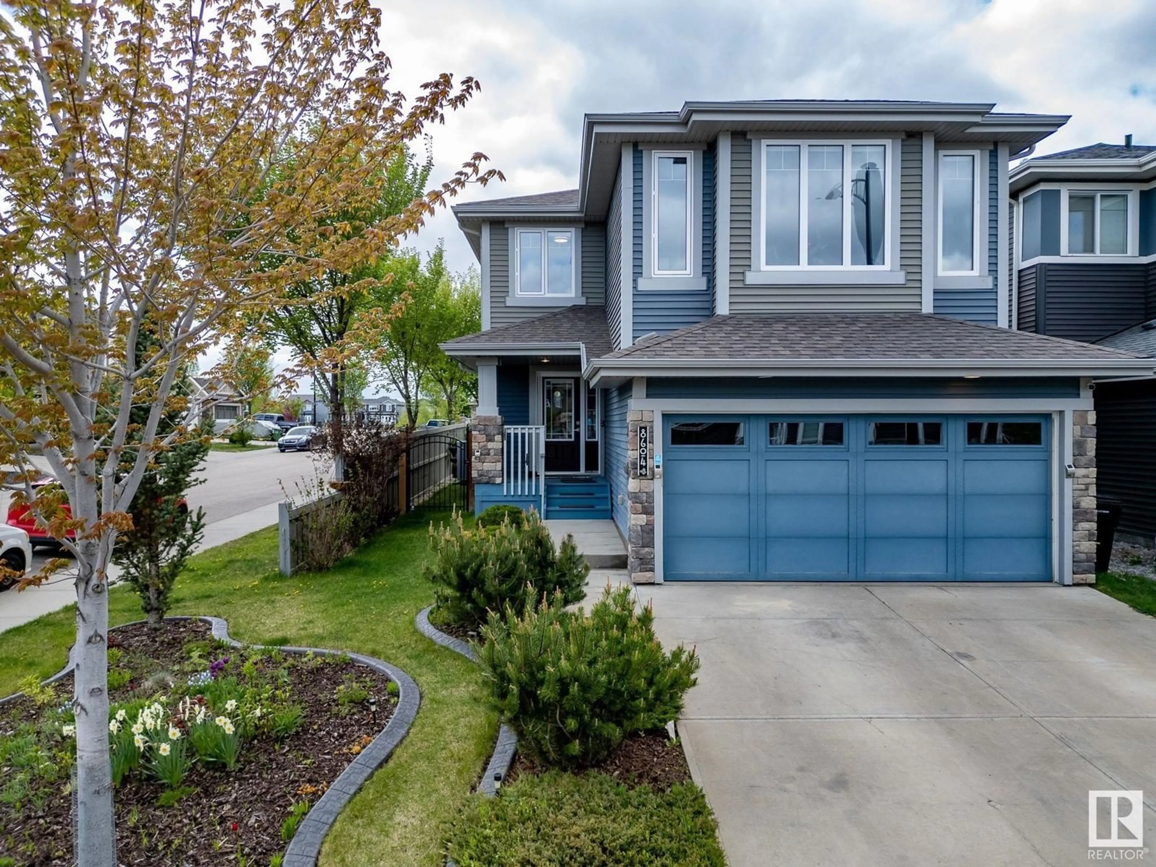 Home with vinyl exterior material, street for NW - 8604 217 ST, Edmonton Alberta T5T4R5