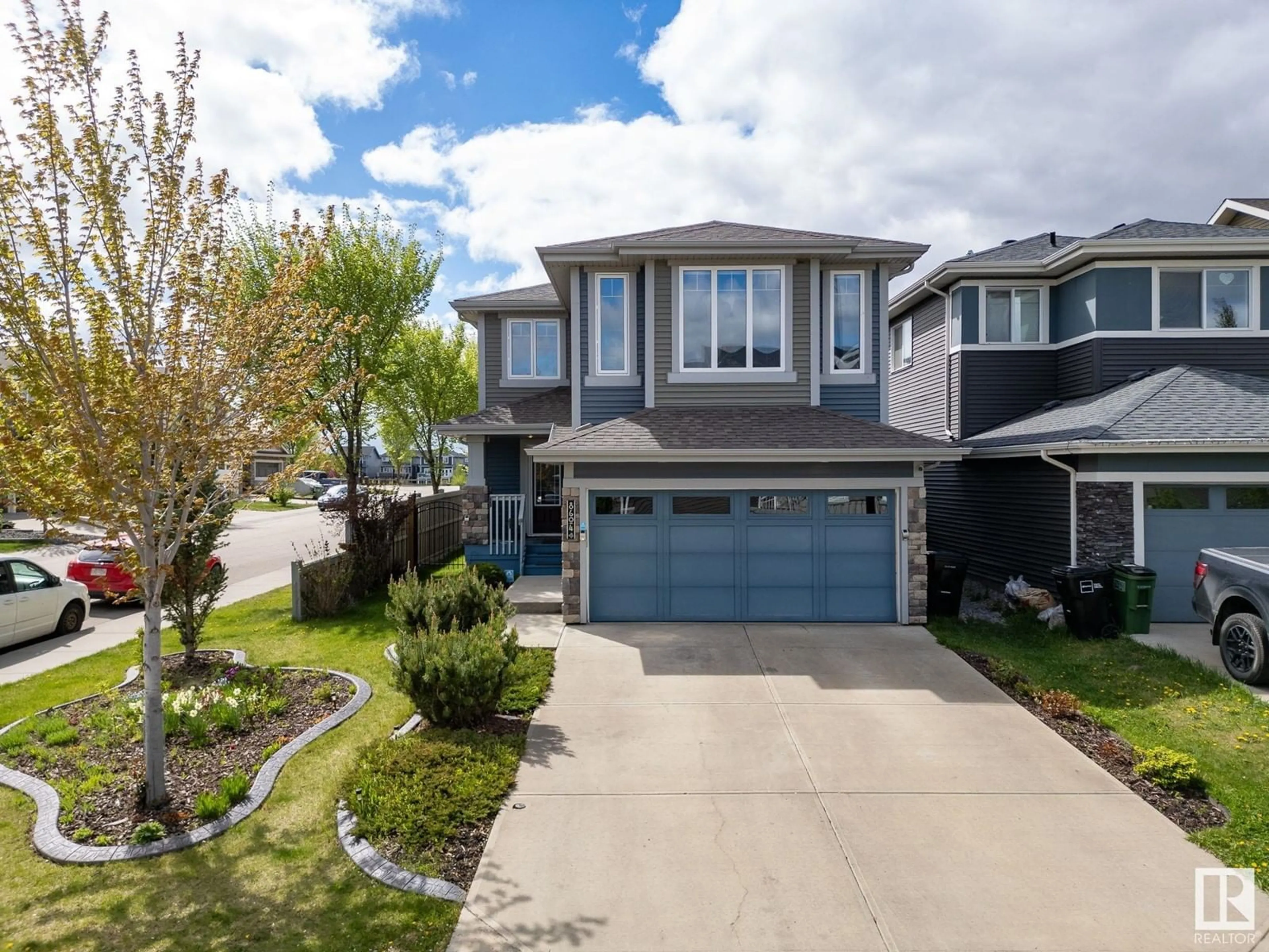 Home with vinyl exterior material, street for NW - 8604 217 ST, Edmonton Alberta T5T4R5