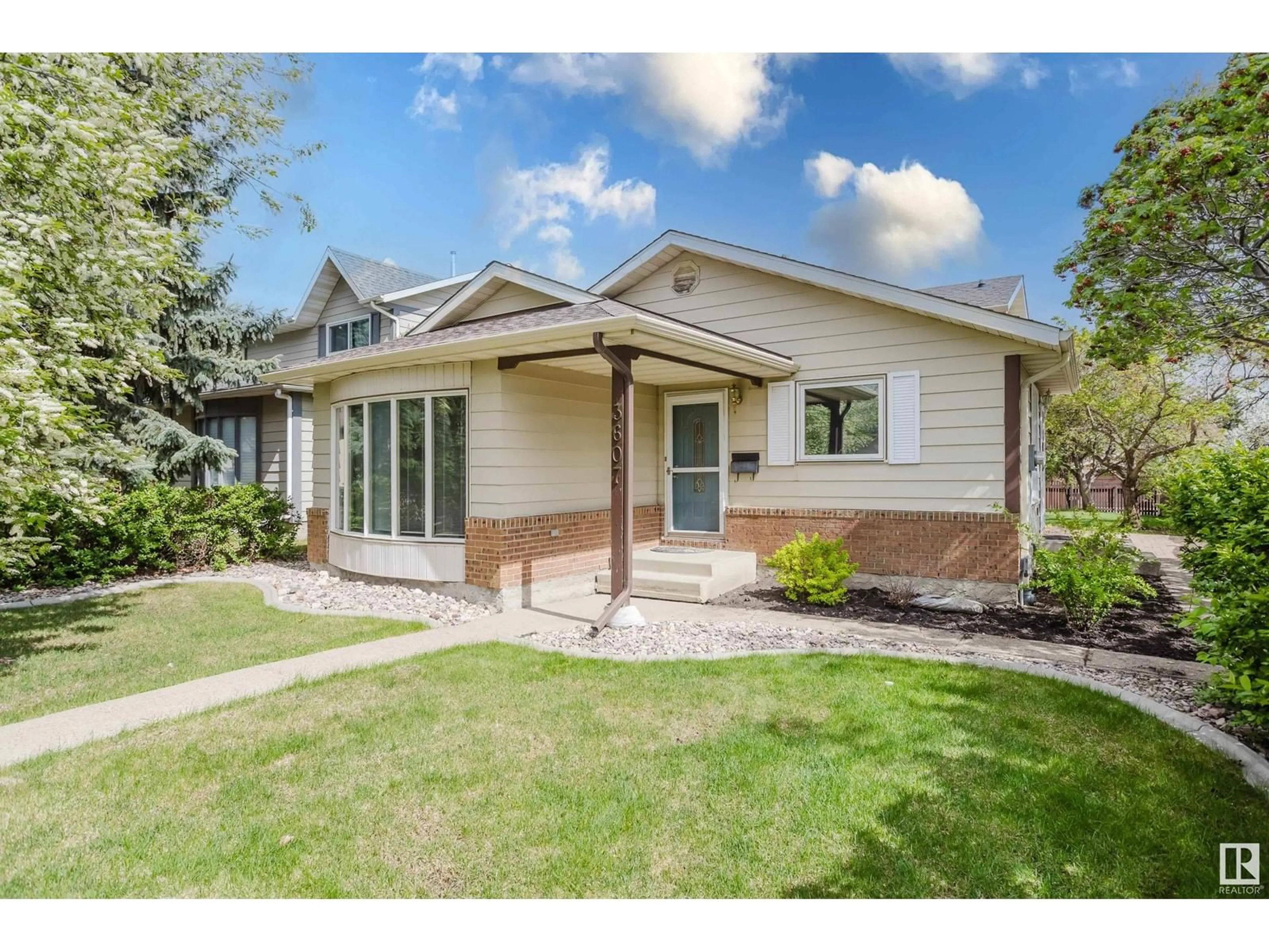 Home with vinyl exterior material, street for NW - 3607 56 ST, Edmonton Alberta T6L2J6