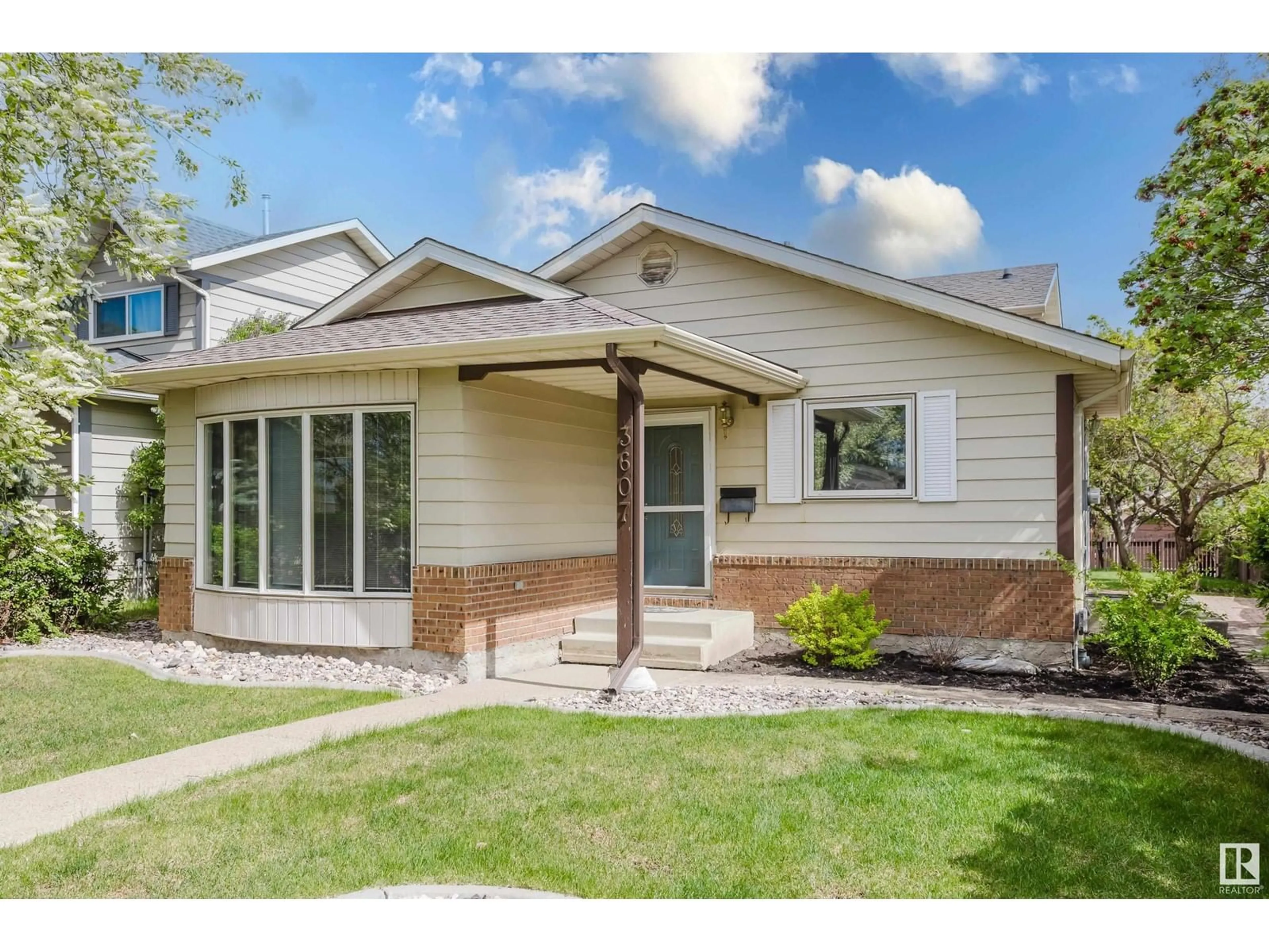 Home with vinyl exterior material, street for NW - 3607 56 ST, Edmonton Alberta T6L2J6