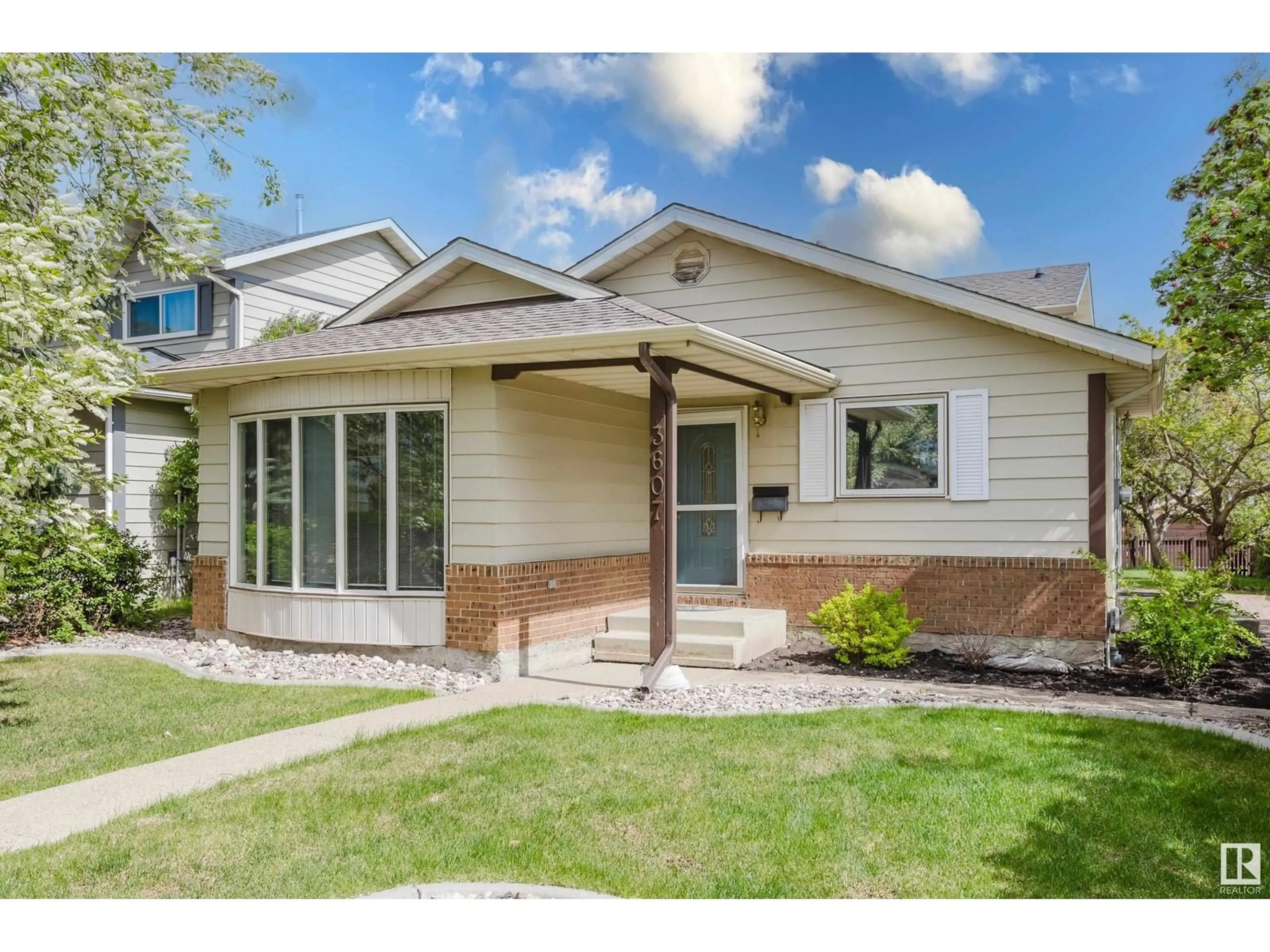 Home with vinyl exterior material, street for NW - 3607 56 ST, Edmonton Alberta T6L2J6
