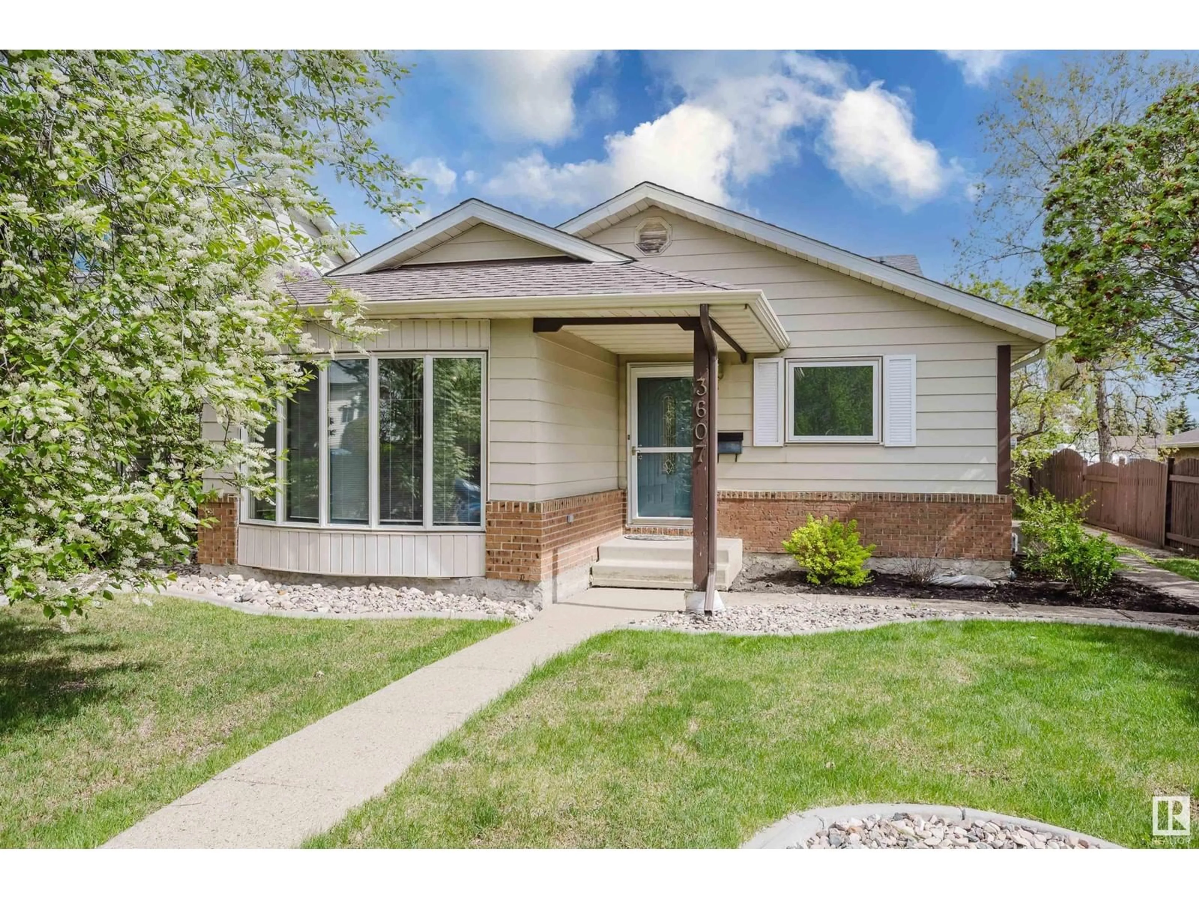Home with vinyl exterior material, street for NW - 3607 56 ST, Edmonton Alberta T6L2J6