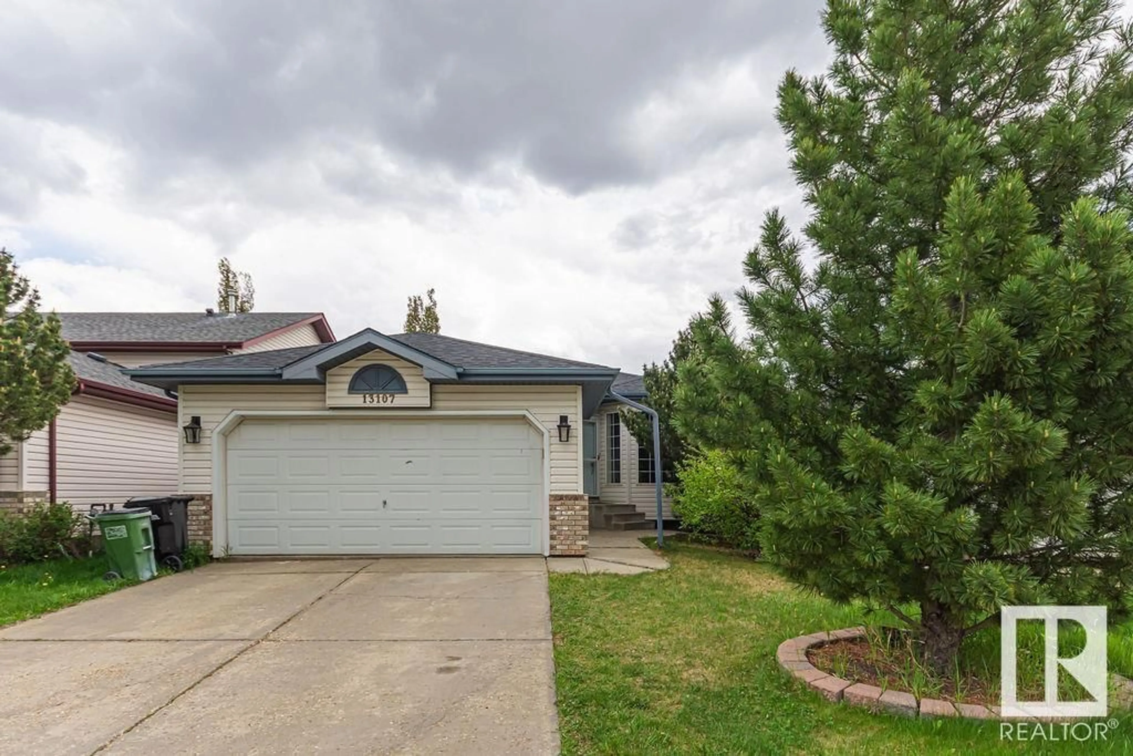 Home with vinyl exterior material, street for 13107 36 ST, Edmonton Alberta T5A5C7