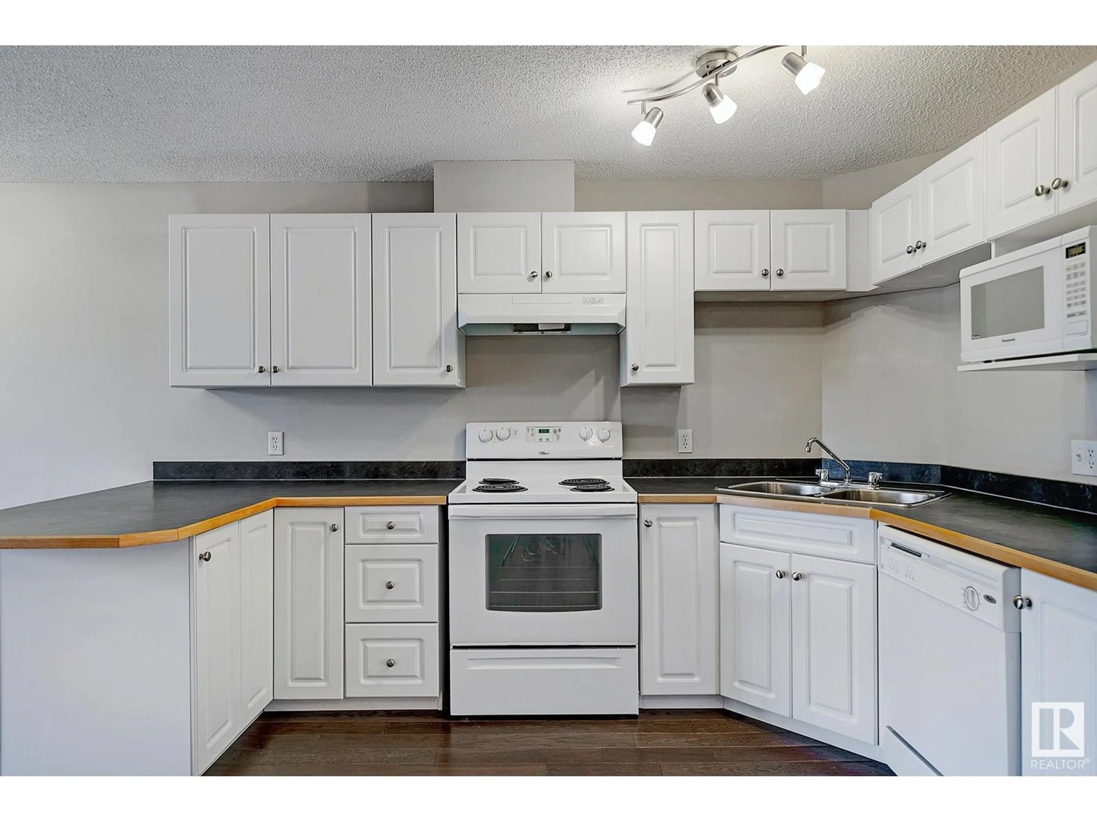Standard kitchen, wood/laminate floor for #212 - 5350 199 ST, Edmonton Alberta T6M0A4