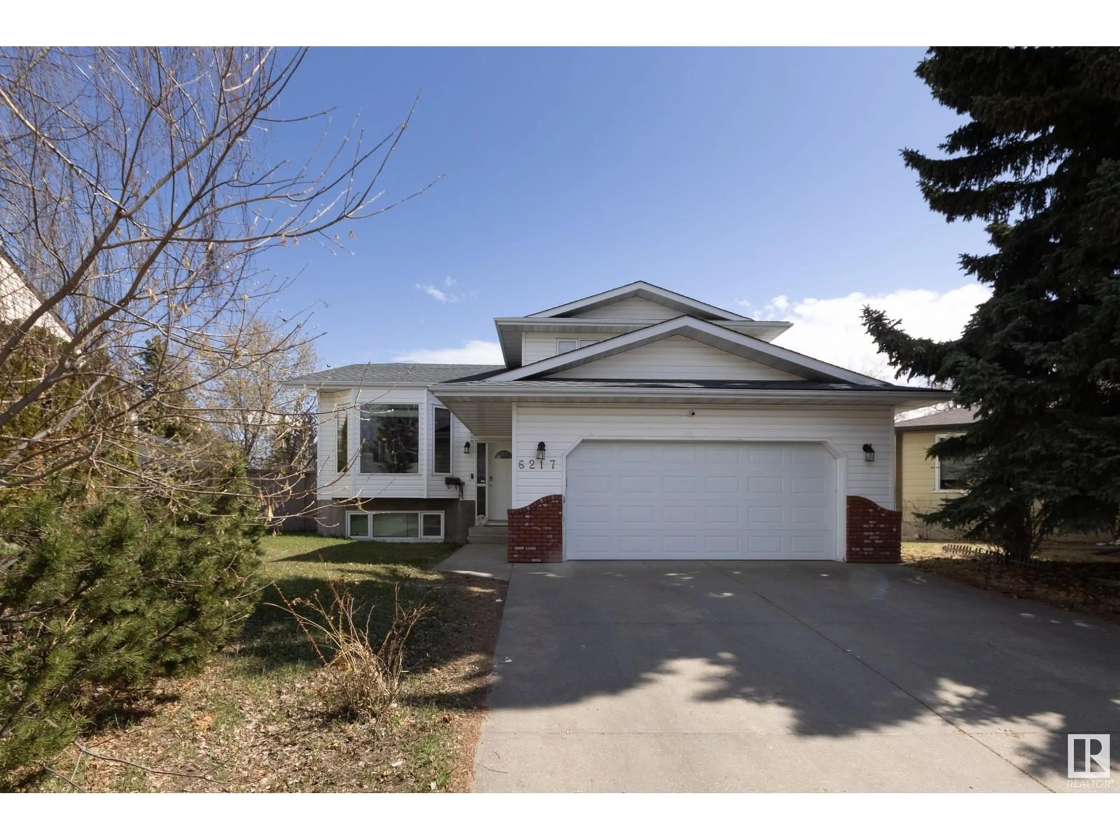 Home with vinyl exterior material, street for NW - 6217 13 AV, Edmonton Alberta T6L2E5