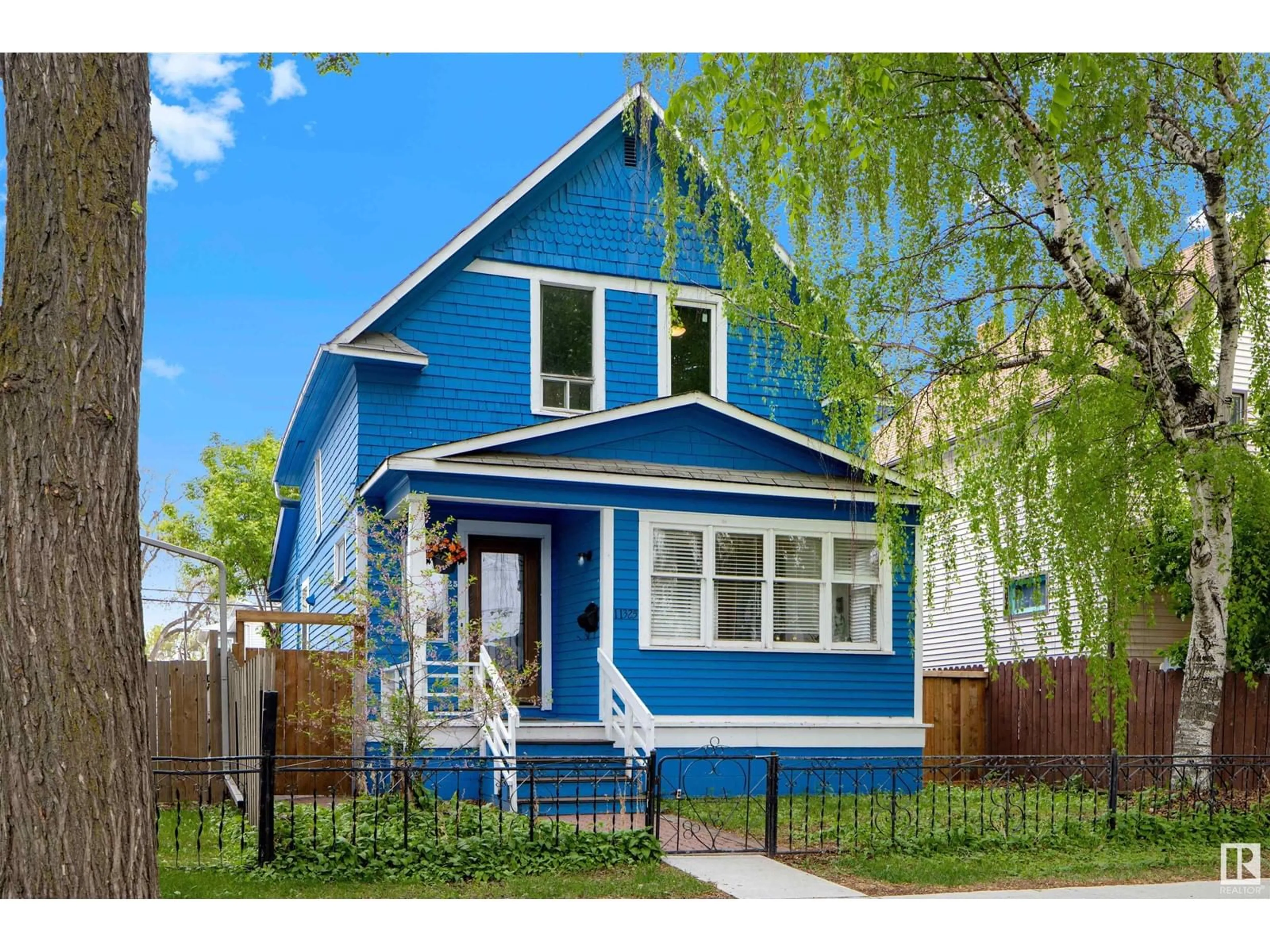 Home with vinyl exterior material, street for 11325 96 ST, Edmonton Alberta T5G1T2