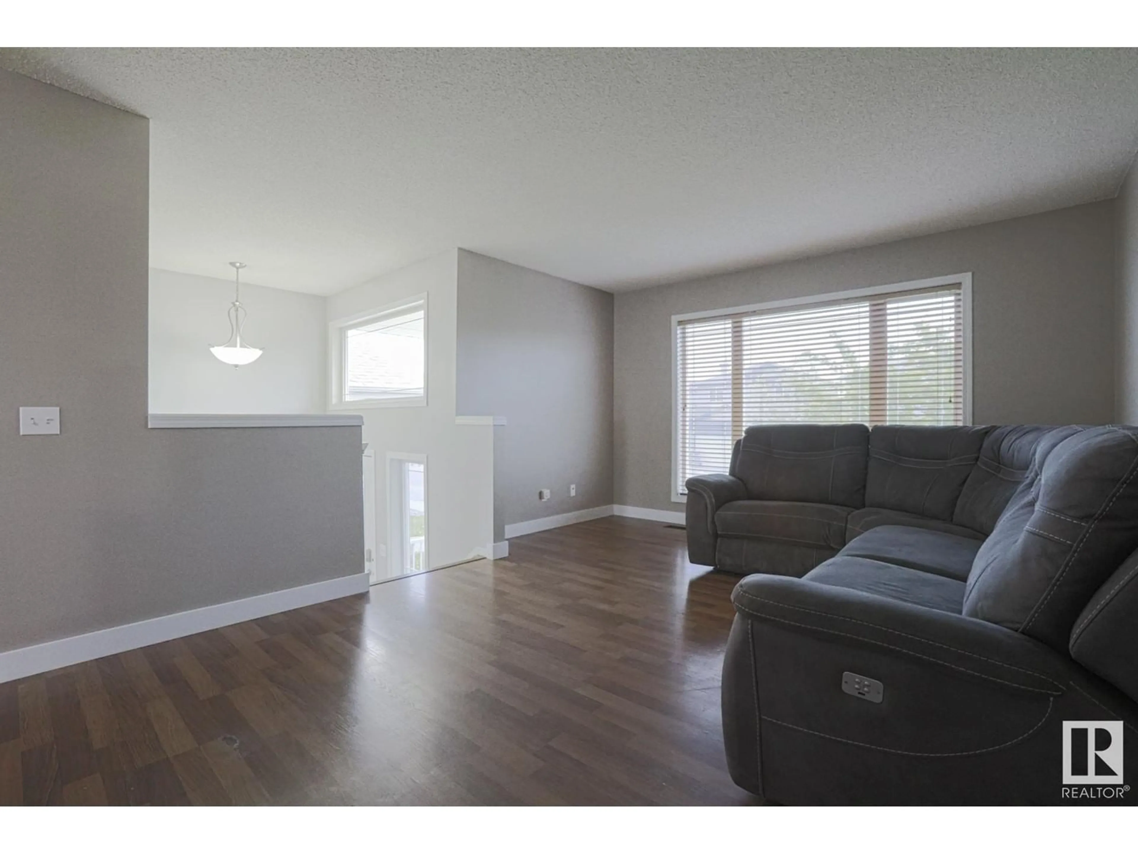 Living room with furniture, wood/laminate floor for 231 BROOKVIEW WY, Stony Plain Alberta T7X2X7