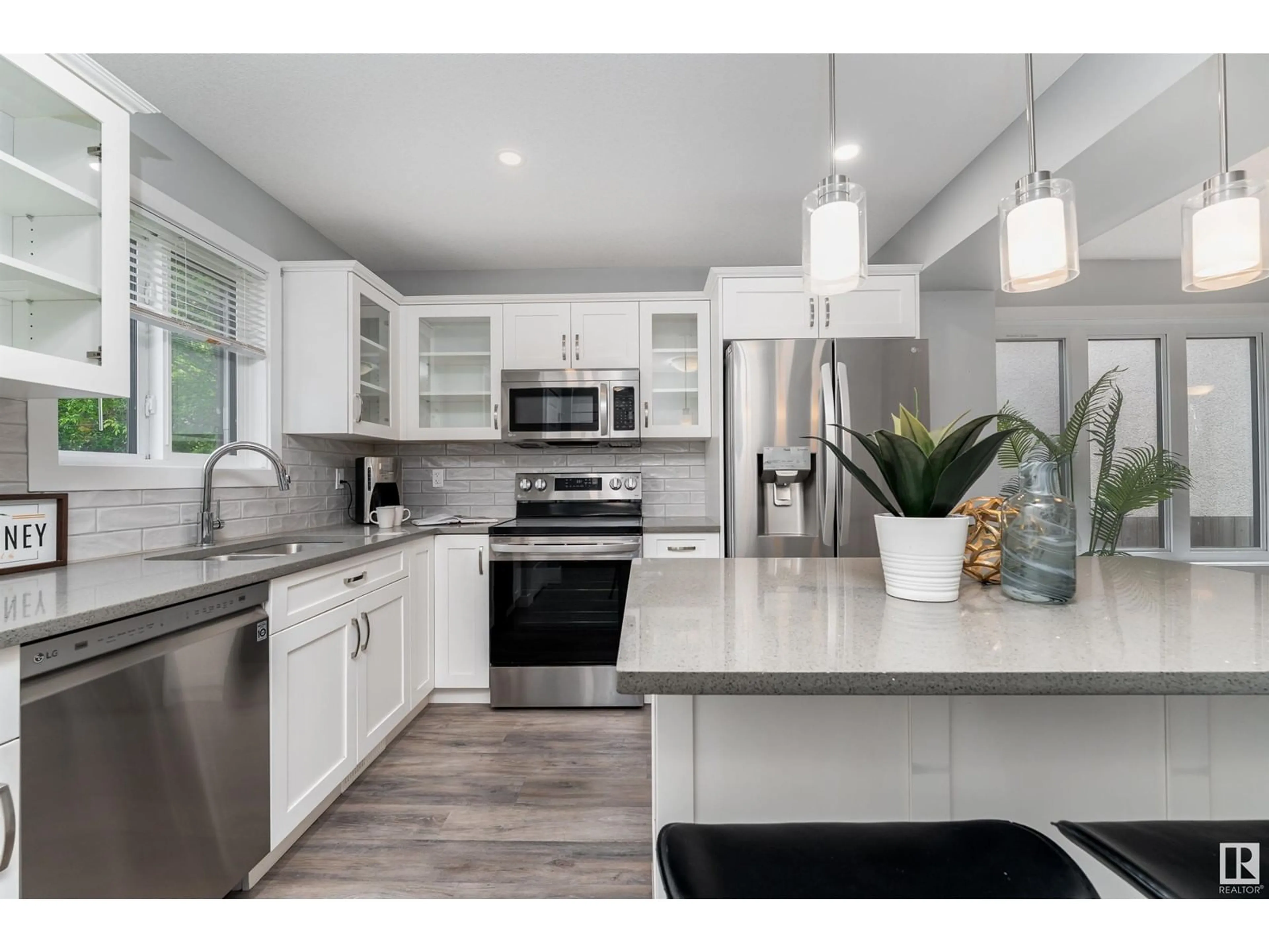 Open concept kitchen, ceramic/tile floor for 12929 69 ST, Edmonton Alberta T5C0H3