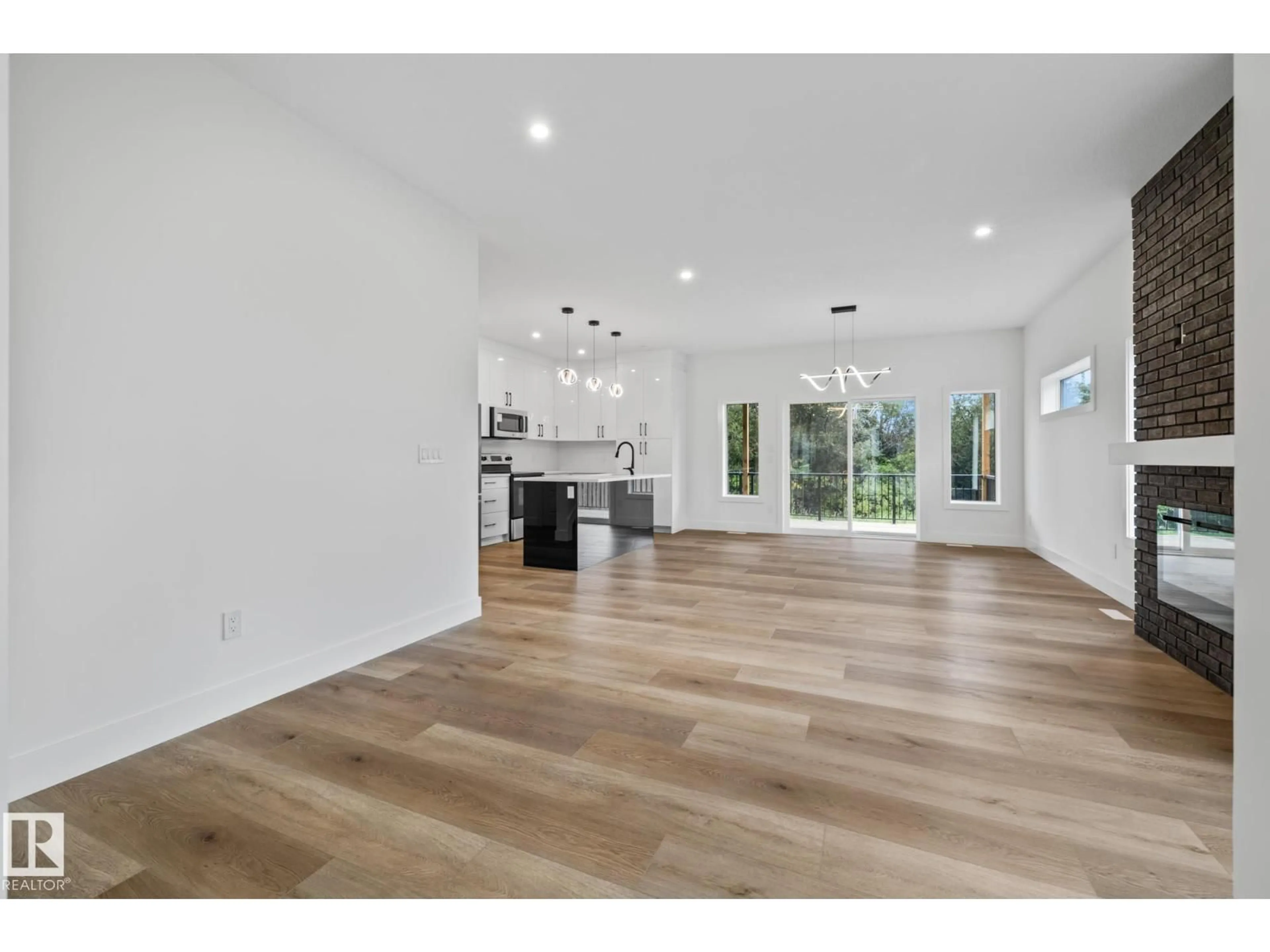 Open concept kitchen, wood/laminate floor for 5213 55 STREET, Wabamun Alberta T0E2K0
