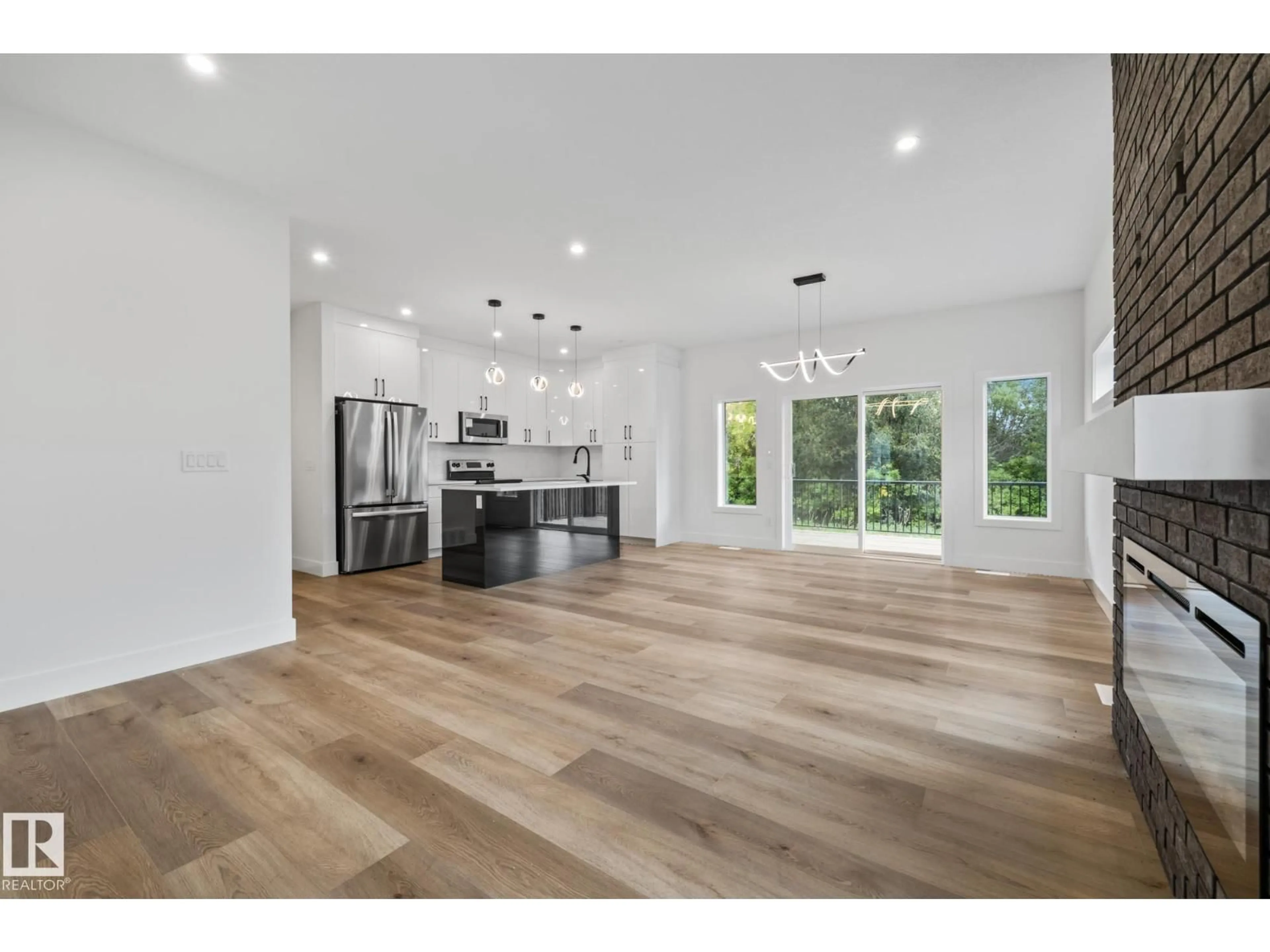 Open concept kitchen, wood/laminate floor for 5213 55 STREET, Wabamun Alberta T0E2K0