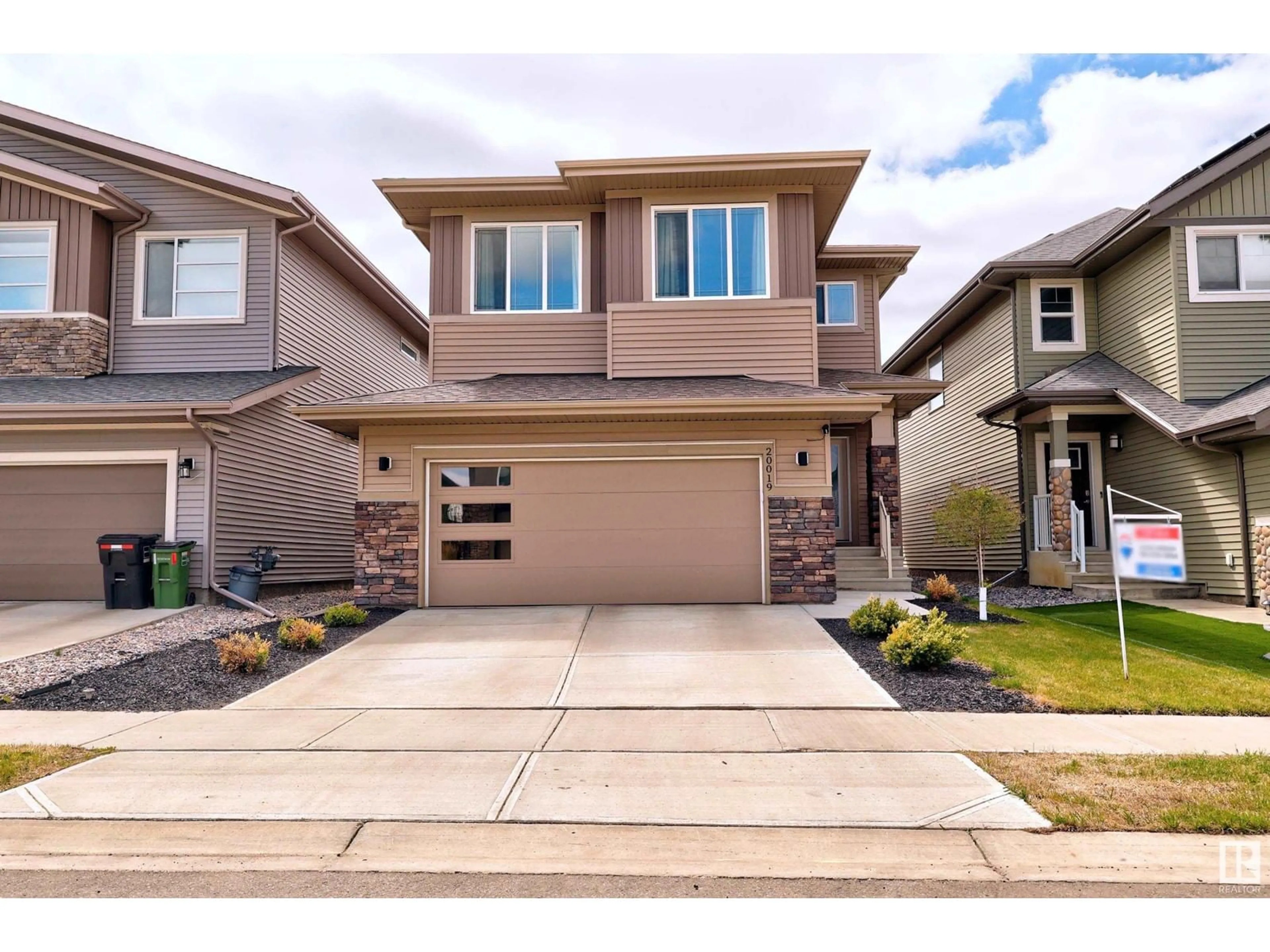 Home with brick exterior material, street for NW - 20019 29 AV, Edmonton Alberta T6M0W8
