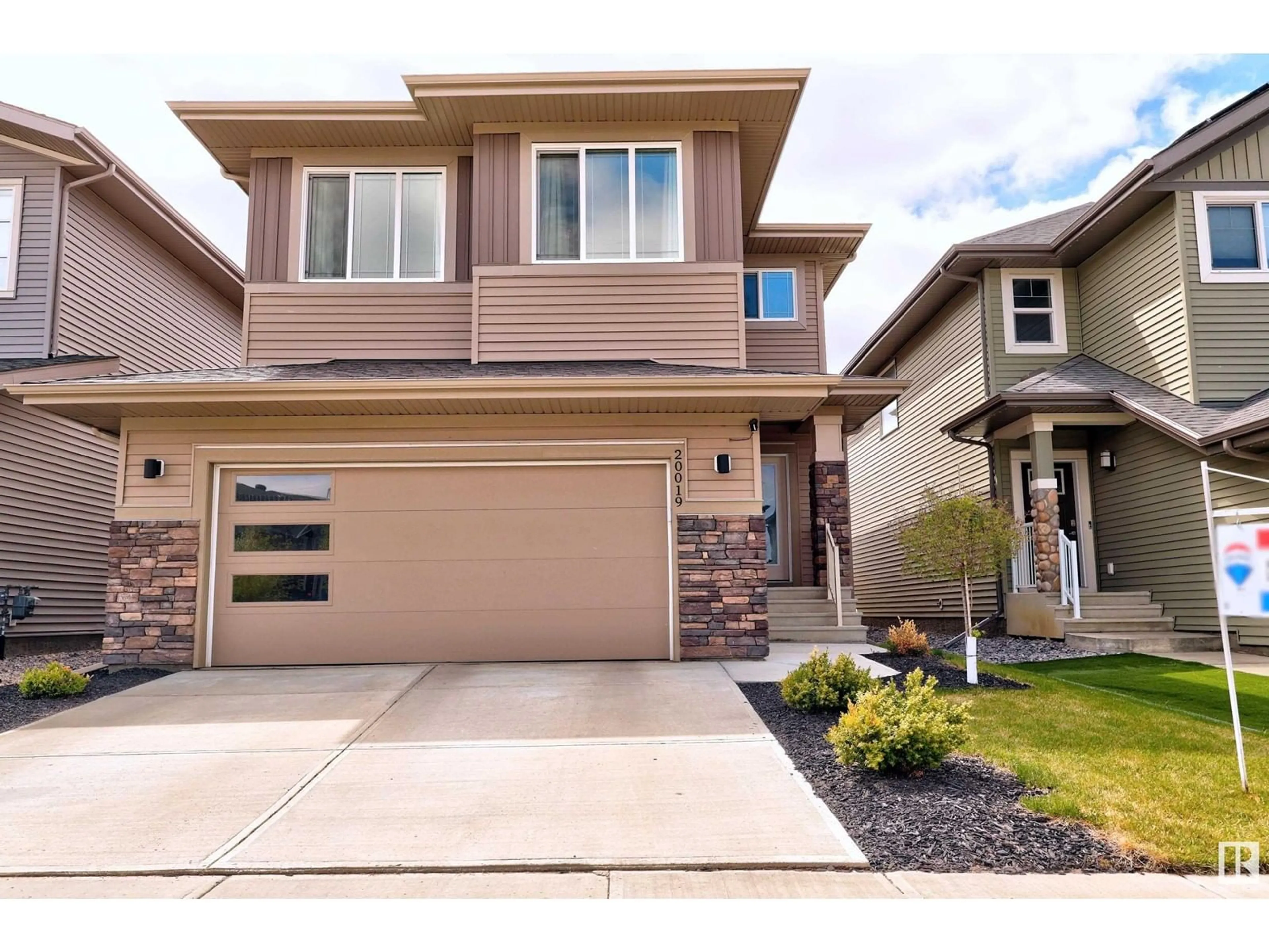 Home with vinyl exterior material, street for NW - 20019 29 AV, Edmonton Alberta T6M0W8