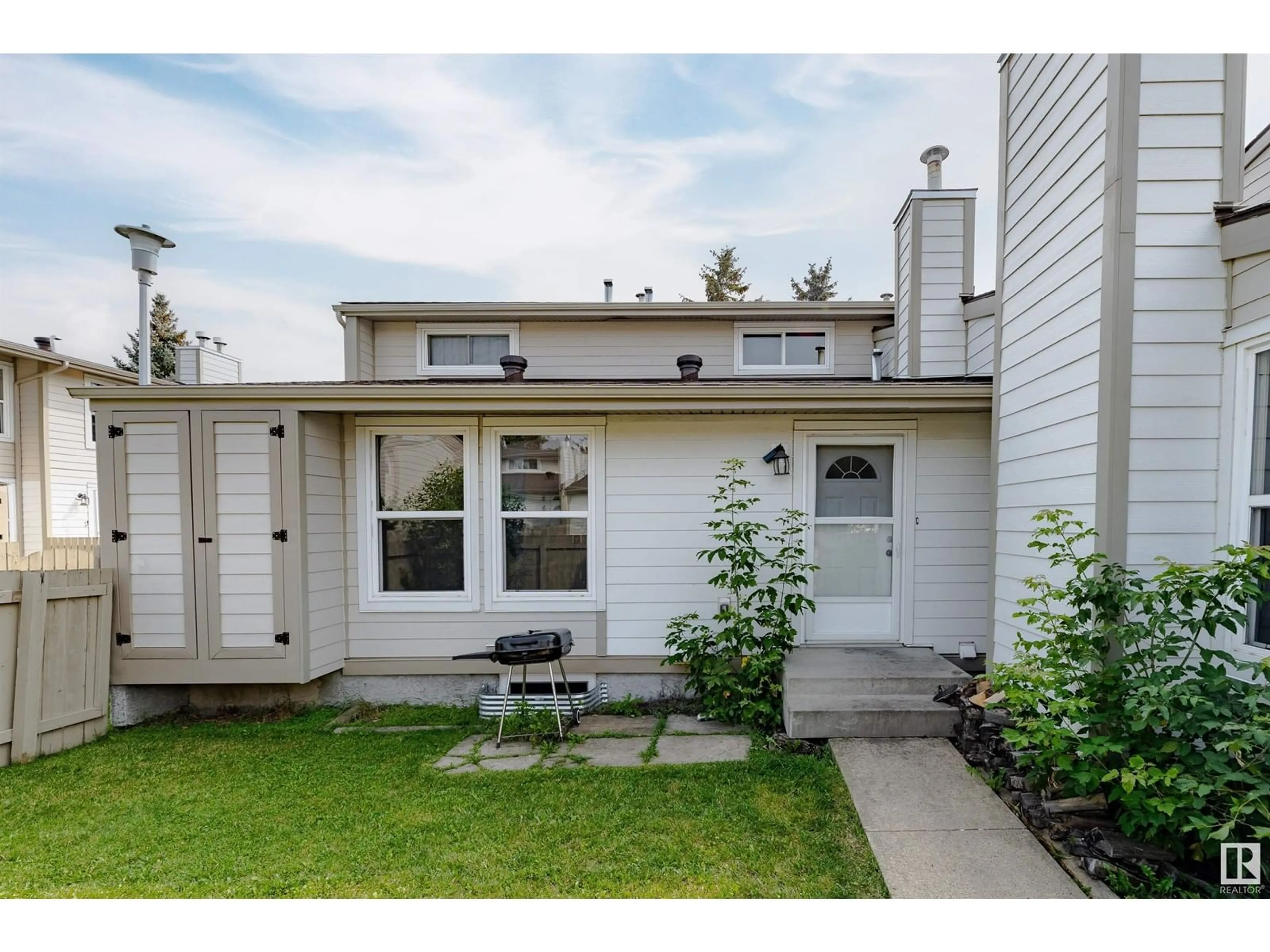 Home with vinyl exterior material, street for 1130 KNOTTWOOD RD, Edmonton Alberta T6K2J8