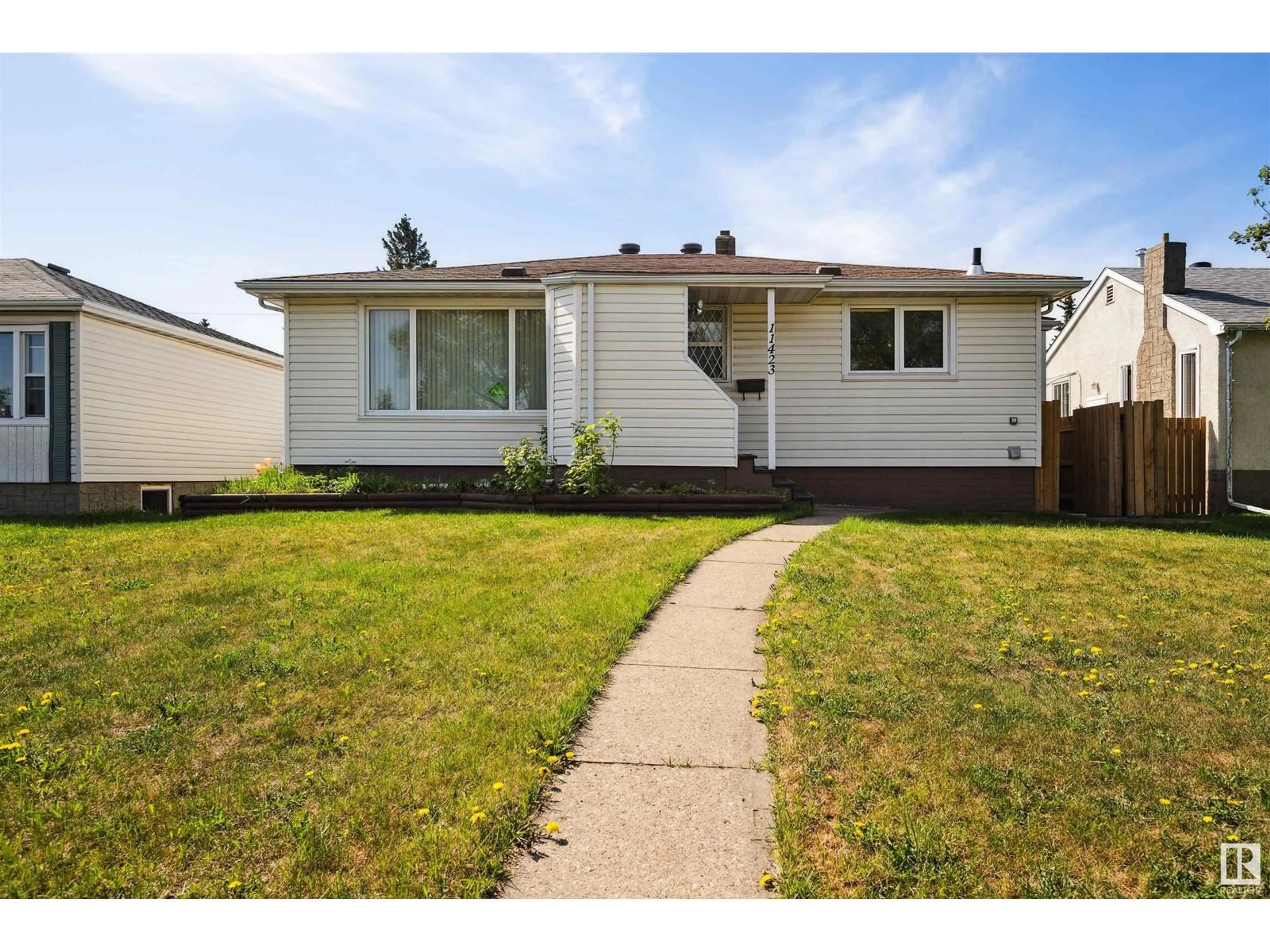 Home with vinyl exterior material, street for NW - 11423 111A AV, Edmonton Alberta T5G0E9