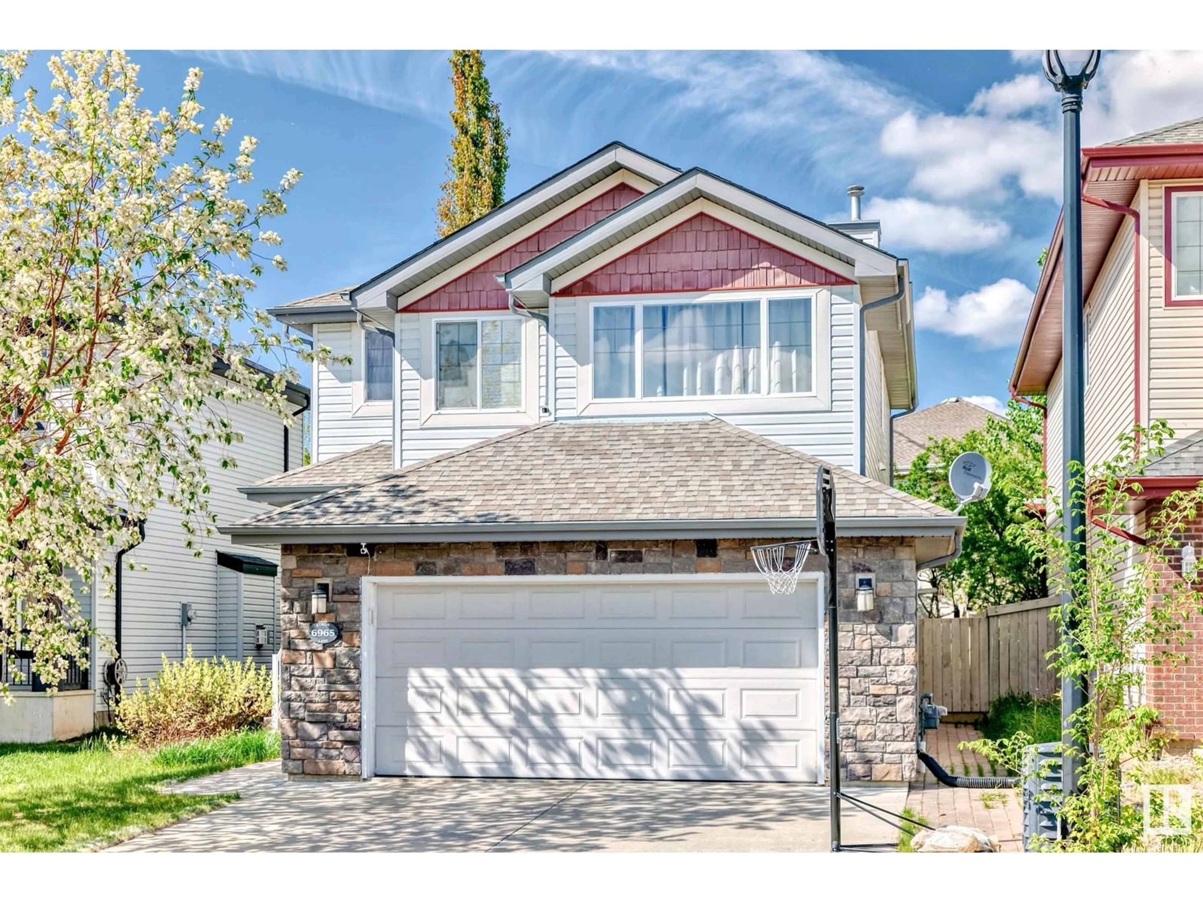 Home with vinyl exterior material, street for 6965 STROM LN, Edmonton Alberta T6R0J9