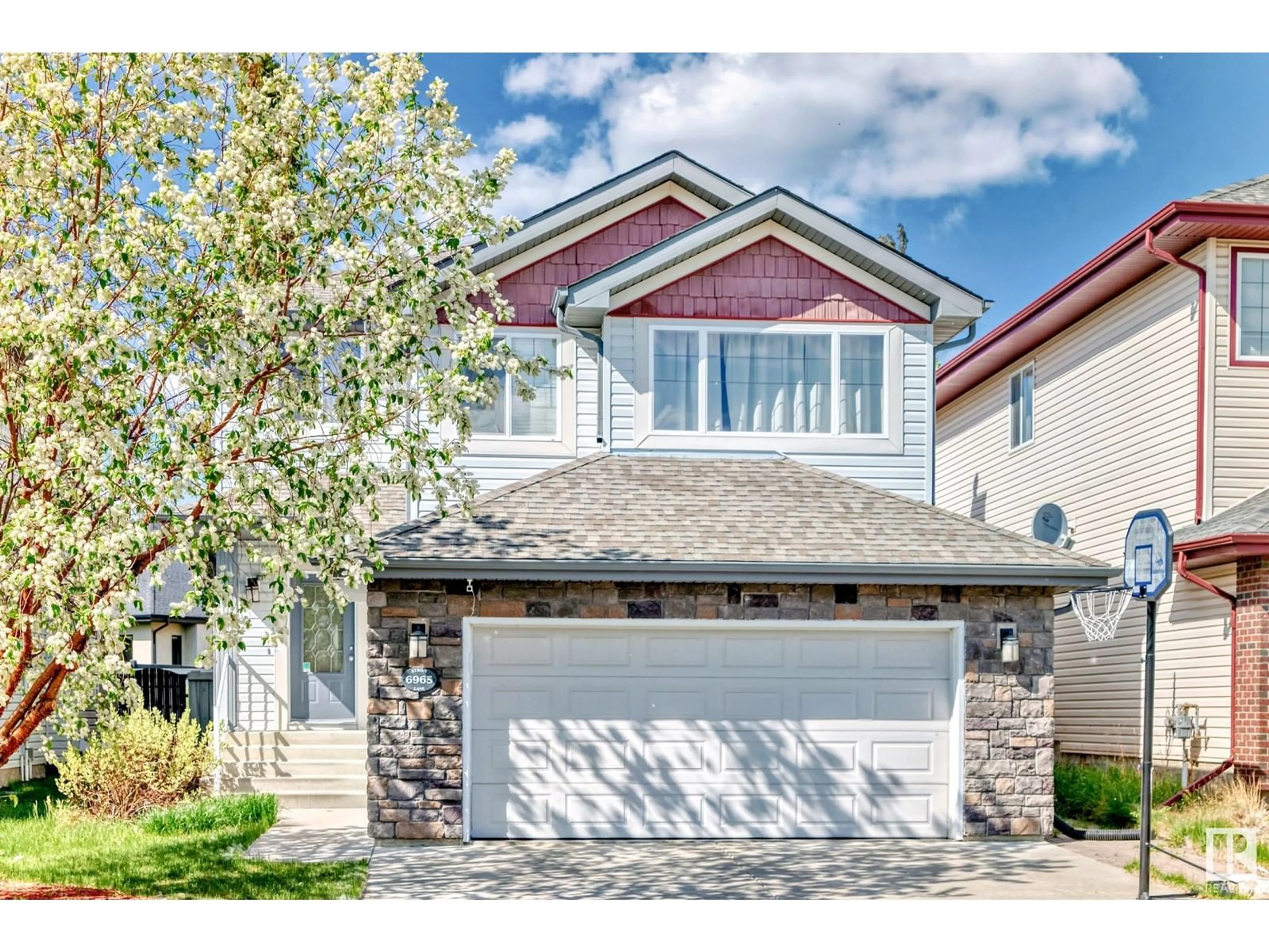 Home with vinyl exterior material, street for 6965 STROM LN, Edmonton Alberta T6R0J9