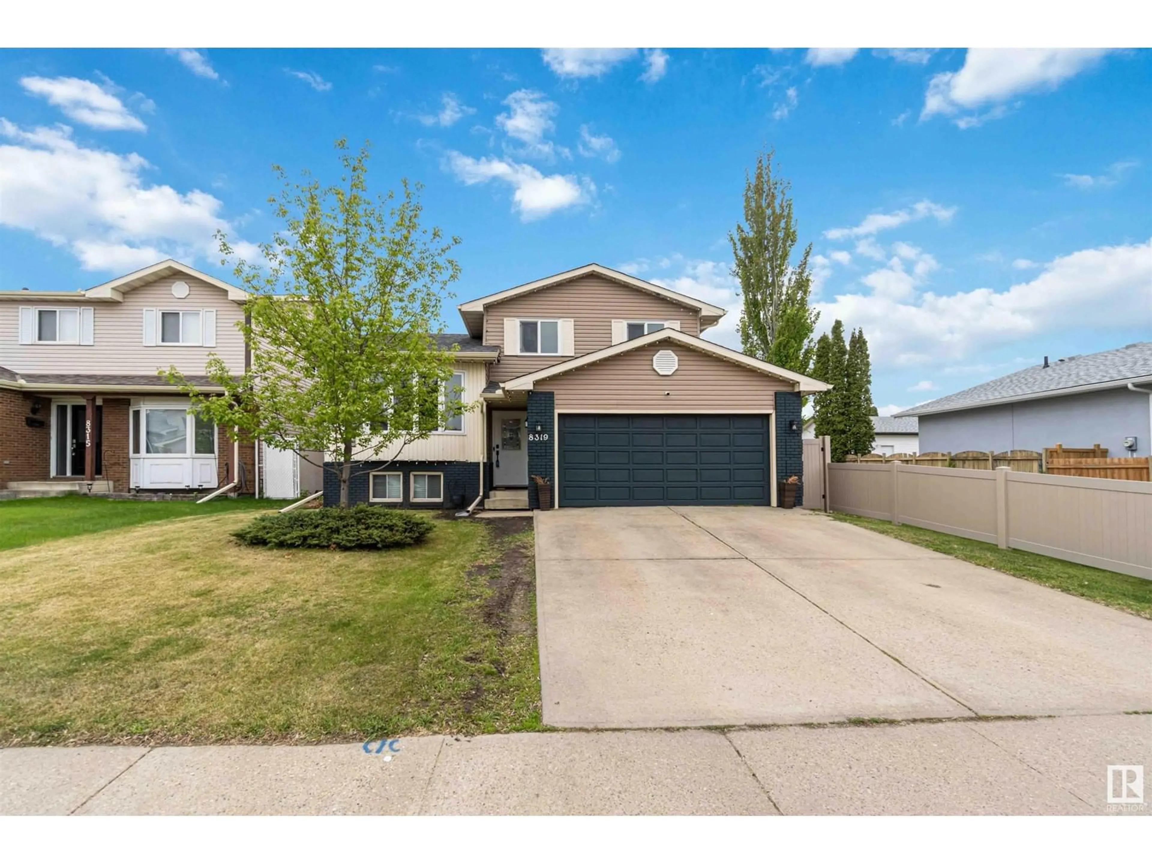 Home with vinyl exterior material, street for NW - 8319 152B AV, Edmonton Alberta T5E6G1