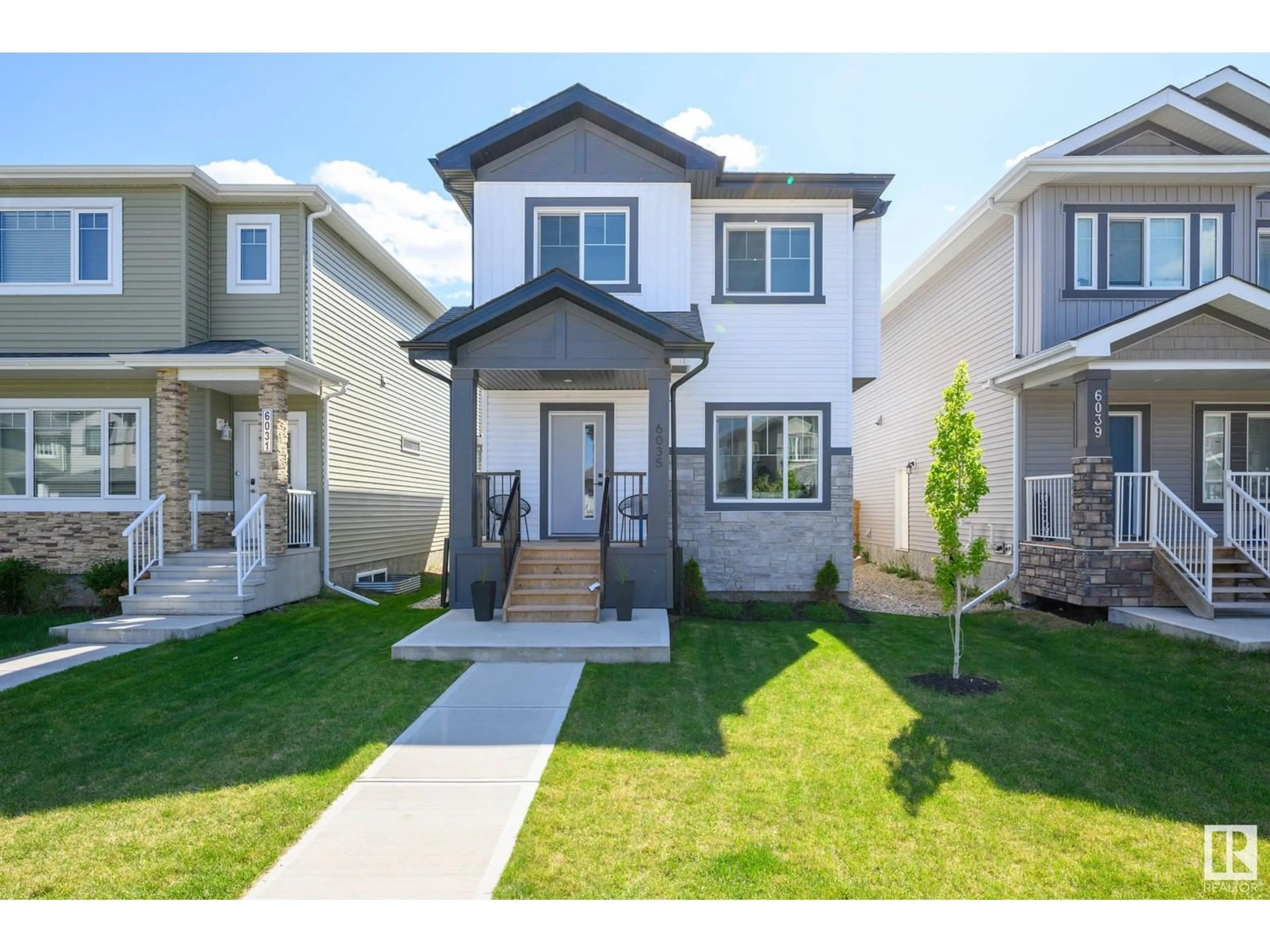Home with vinyl exterior material, street for NW - 6035 180 AV, Edmonton Alberta T5Y3W9