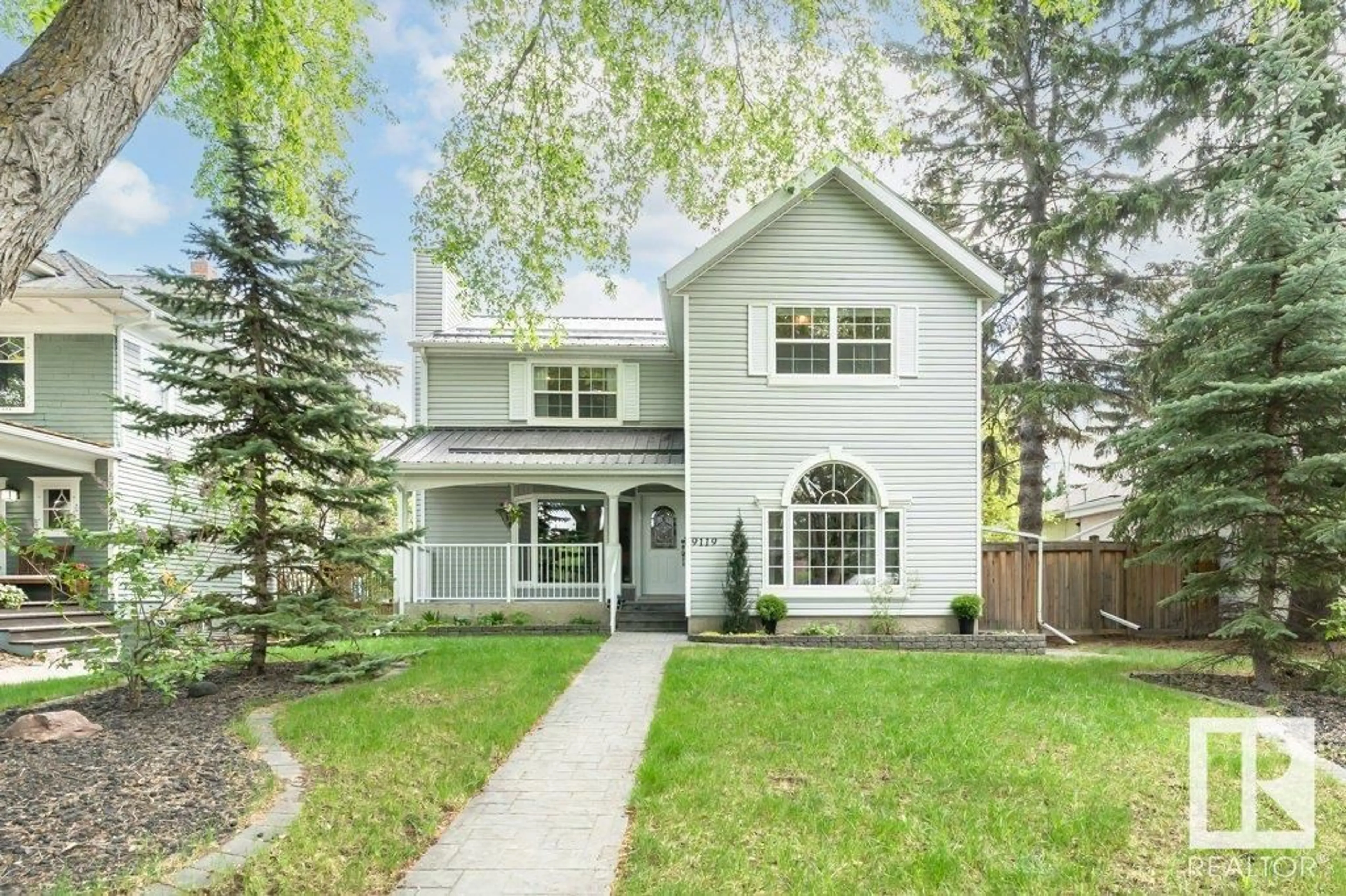 Home with vinyl exterior material, street for 9119 117 ST NW, Edmonton Alberta T6G1S1