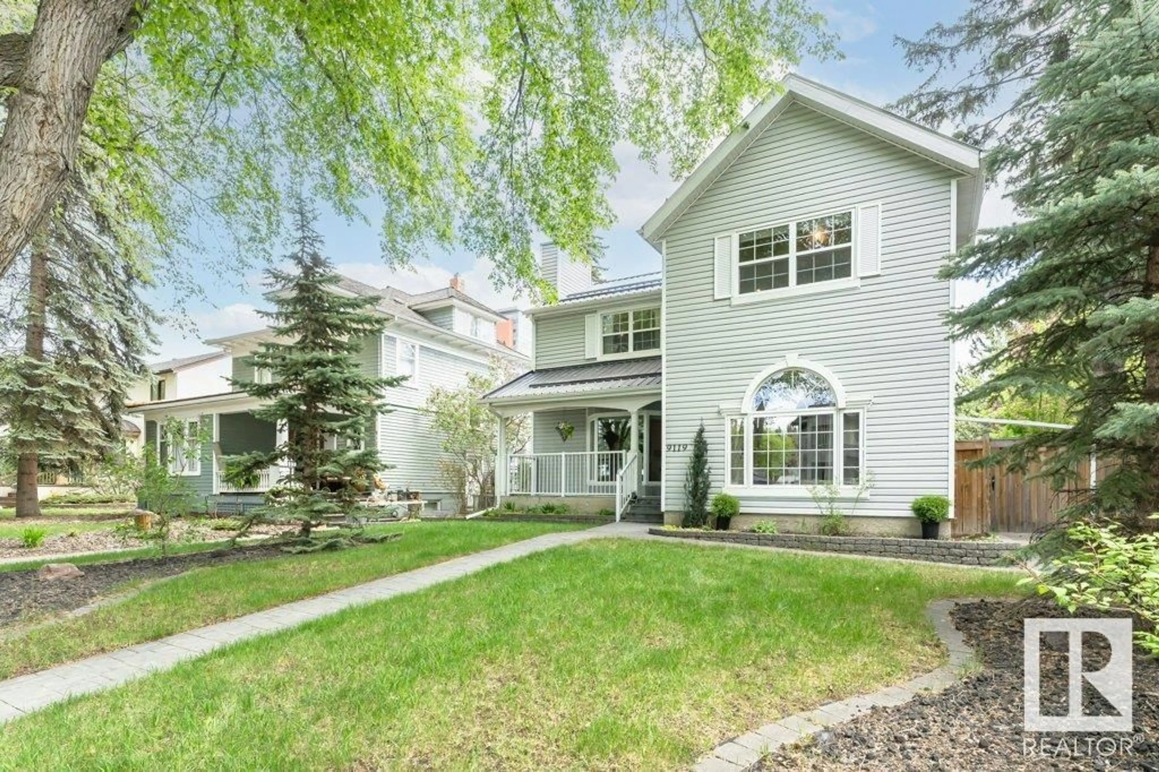 Home with vinyl exterior material, street for 9119 117 ST NW, Edmonton Alberta T6G1S1
