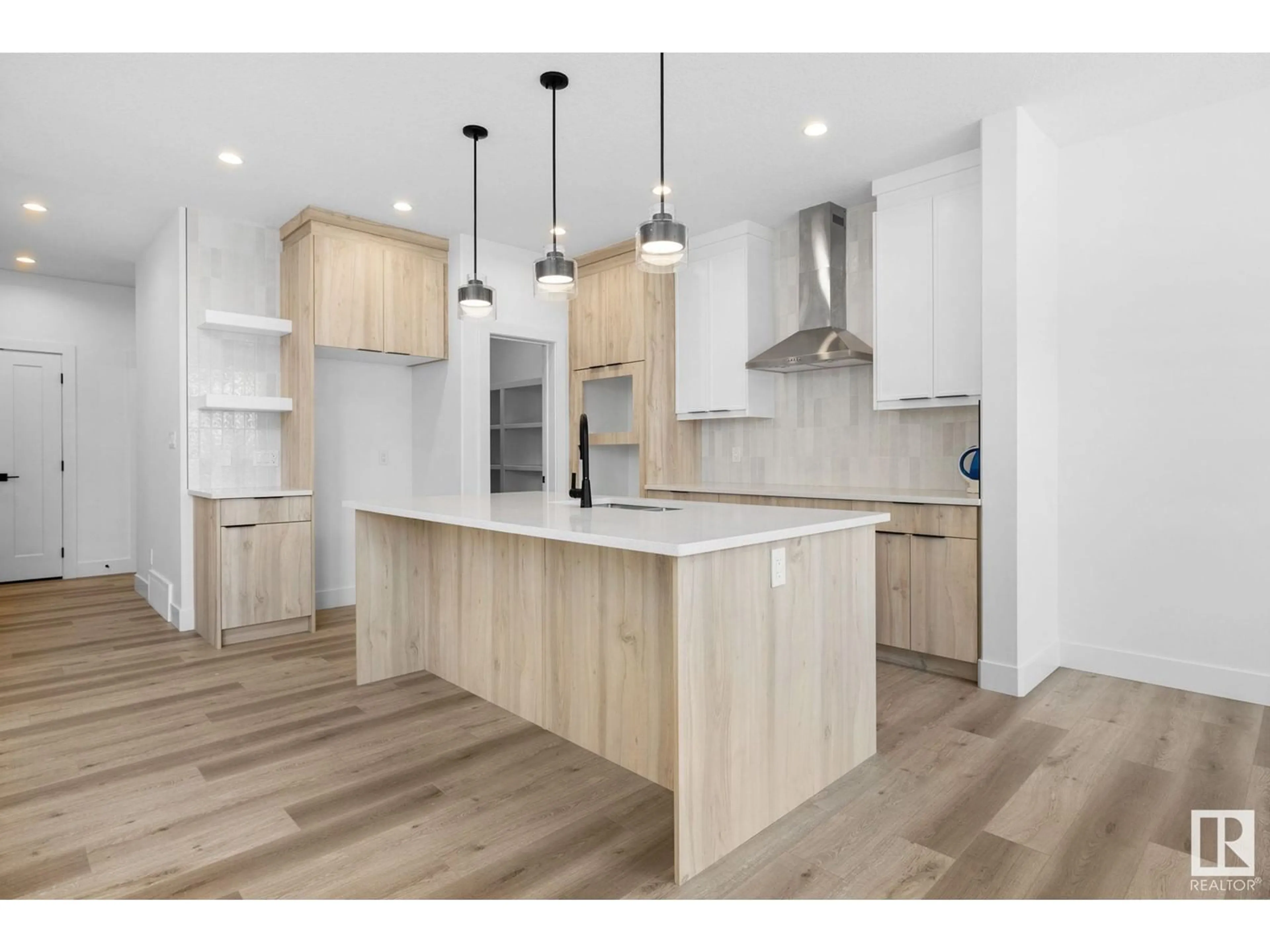 Open concept kitchen, wood/laminate floor for 177 CALEDON CR, Spruce Grove Alberta T7X4E3