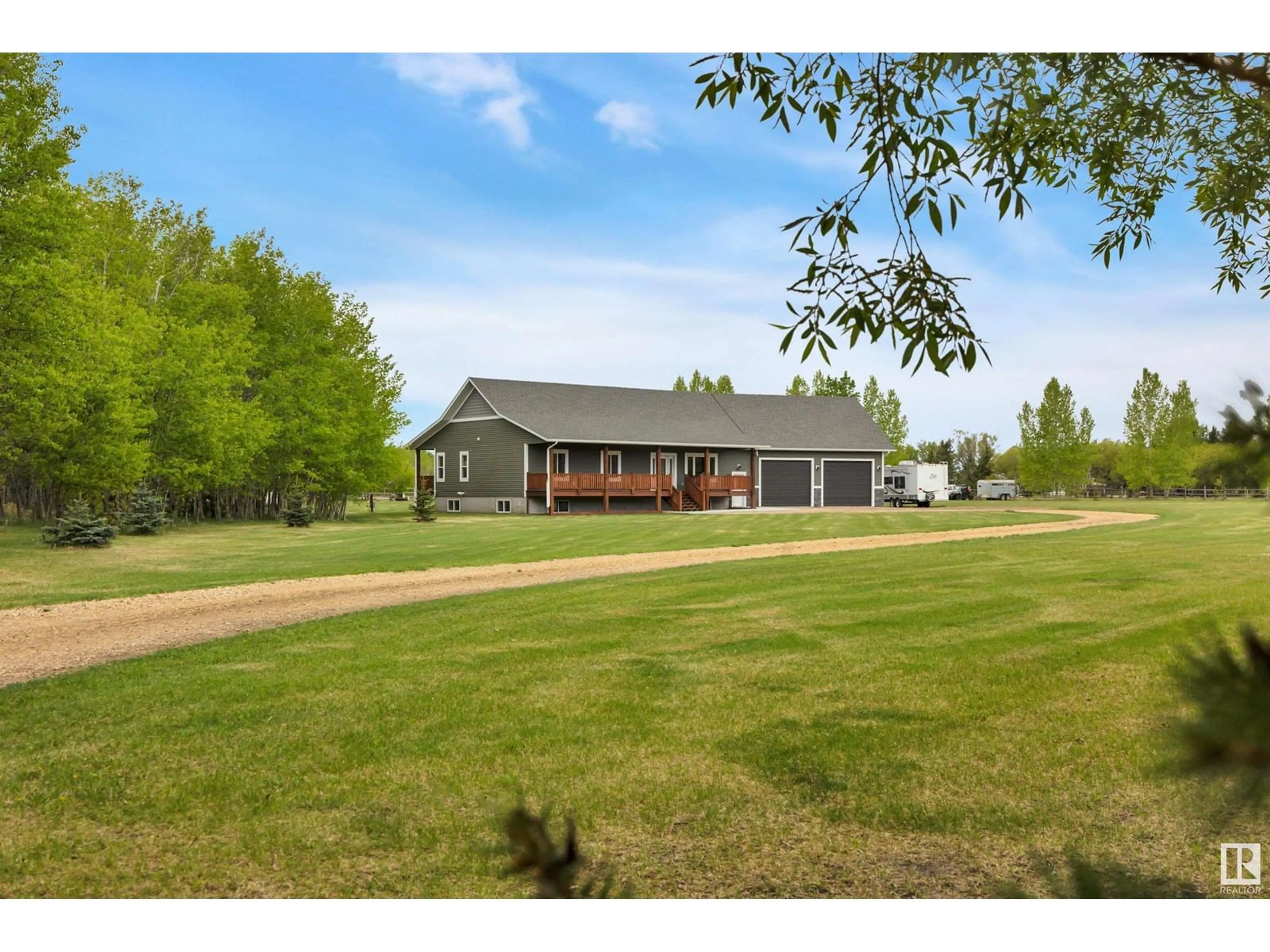 A pic from outside/outdoor area/front of a property/back of a property/a pic from drone, water/lake/river/ocean view for 471042 RR242 A, Rural Wetaskiwin County Alberta T9A1X1