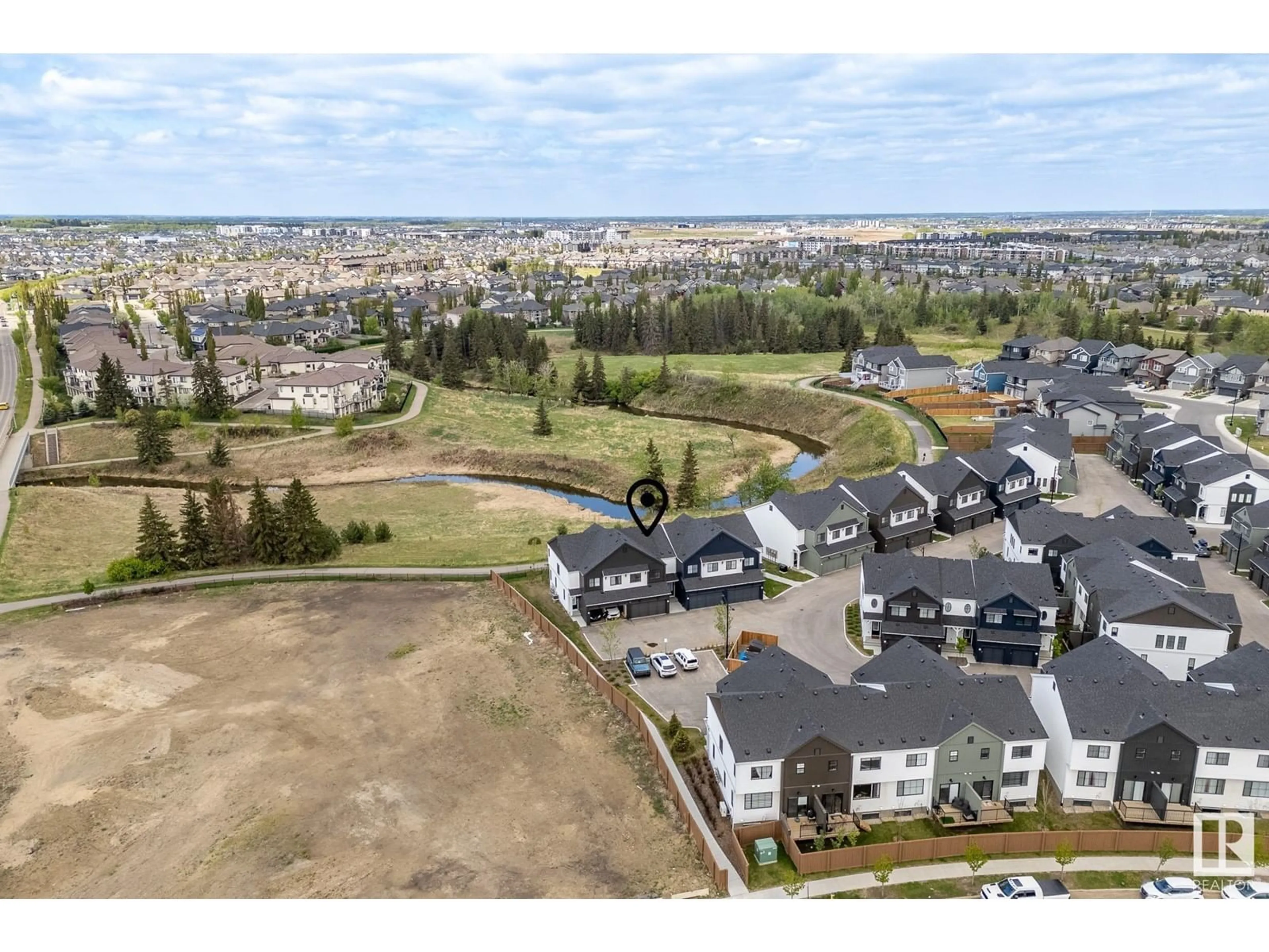 A pic from outside/outdoor area/front of a property/back of a property/a pic from drone, mountain view for #22 - 1910 COLLIP VIEW VW, Edmonton Alberta T6W5H4